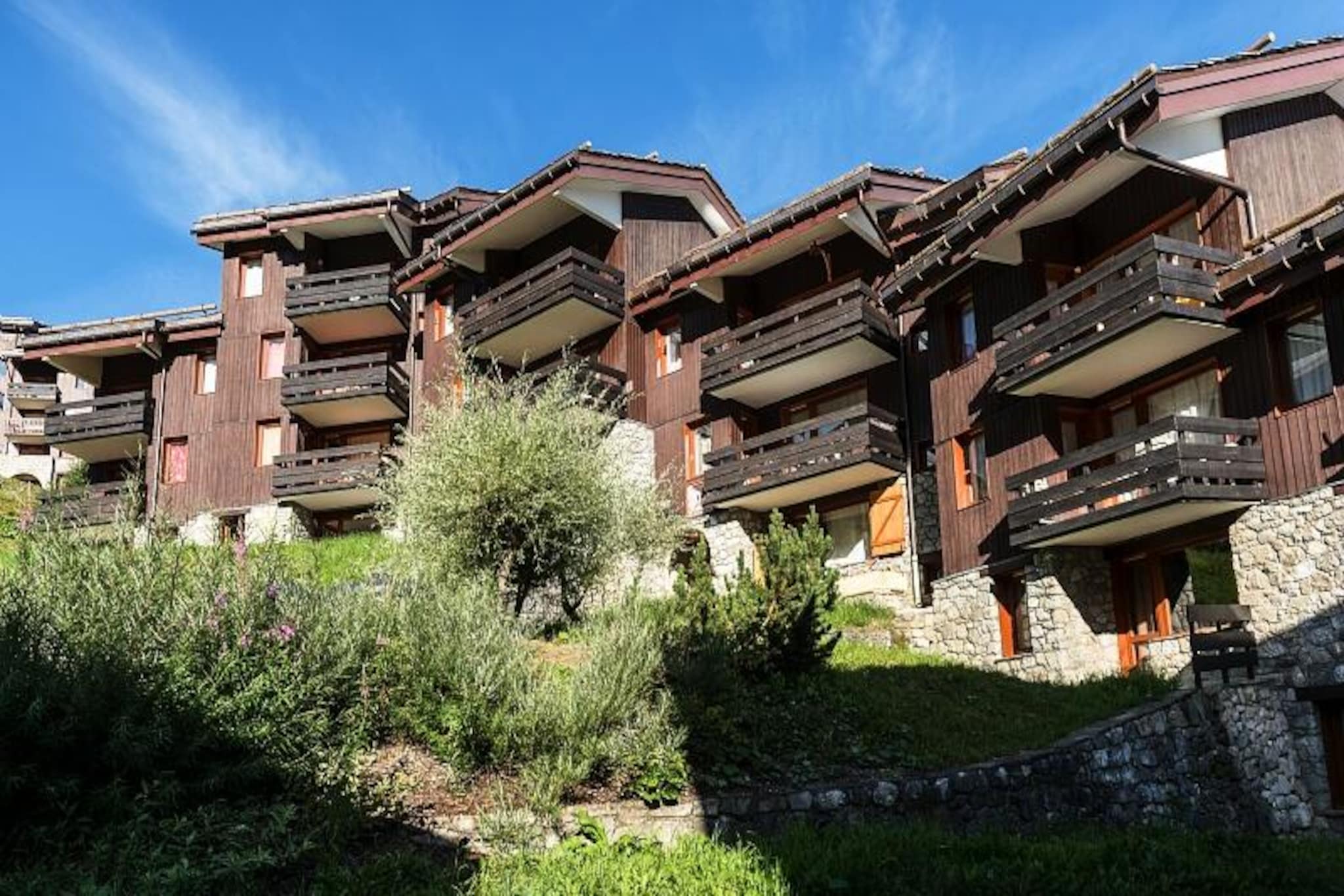 This property, along with its spacious layout, provides a comfortable studio-style apartment ideal for up to 4 guests. The living area features 2 sofa beds and a BZ sofa for additional sleeping arrangements. A dining table with seating for three, including a bench, complements the living space. The apartment includes a separate bathroom with a bathtub and a WC. Located on the ground floor, the apartment has direct access to the slopes and the ESF, making it perfect for winter sports enthusiasts. The property is pet-friendly, with additional charges, and provides optional services like a baby kit (subject to availability) and WiFi for an extra fee. While activities like skiing are included due to the ski-in/ski-out access, other amenities and services such as bed linen and cleaning are available at an extra charge.

Nestled in the Crève Cœur district, the residence is perfectly positioned for both winter and summer activities. The slopes and hiking trails are easily accessible directly from the property, offering an exceptional location for outdoor enthusiasts. The center of Valmorel, with its shops and restaurants, is a short walk away, and a small cable car, the Télémbourg, connects the residences to the village center for even easier access to amenities. Additionally, the nearest ski lifts are within a 5-minute walk, making this property highly convenient for skiing. The Maeva Home agency is located less than a kilometer from the residence, further enhancing the location’s appeal.

The apartment's kitchen area is open to the living room, providing a seamless flow for preparing meals while enjoying the living space. The kitchen is equipped with essential appliances, including a stovetop and refrigerator. The bathroom is well-equipped with a bathtub, and the WC is separate for added convenience. For relaxation, the large living room can be separated into two independent areas using a movable partition. Outside, a terrace offers additional space to unwind after a day of skiing or hiking. Additional services such as daily cleaning and linen changes are available upon request, with parking available through a separate reservation system during the winter months.



