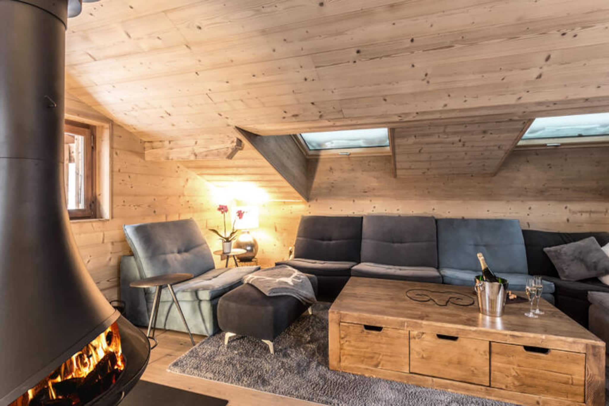 Property, along with its spacious layout and modern amenities, accommodates up to 13 guests across 221 m² of living space. It features six bedrooms, including a master bedroom with a double bed and adjoining shower room, two additional double rooms, and a mixed bedroom with multiple single beds. The chalet also includes a cozy living room with a suspended stove, a sofa for relaxation, and a large dining area, perfect for group gatherings. Guests can enjoy a beautiful view of the surrounding area from various rooms and balconies, including a west-facing balcony off the living room. While pets are not allowed, the property offers free Wi-Fi, and services like end-of-stay cleaning and made-up beds upon arrival are included. A games and sports area, including a ping-pong table, darts, and a yoga mat, ensures there is always something to do on-site.

Ideally located in the Lower Village, the chalet is just 250 meters from the nearest shuttle stop and offers easy access to key attractions. The ski lessons and ice rink departure points are right next door, while the Beauregard and Ice Rink cable cars are also within walking distance. In the summer, the nearby leisure center offers a range of activities for visitors. The property is well-connected, with the La Clusaz bus station only 250 meters away and the Annecy SNCF train station located 32 km away. With its central location, guests can easily explore the resort’s slopes or enjoy the local village life.

The chalet’s kitchen is fully equipped with modern appliances, including induction hobs, two ovens, a microwave, a dishwasher, and a large refrigerator. There is also a Nespresso machine for coffee lovers and plenty of storage space. The open-plan kitchen flows into the relaxation area, which includes a bar, a TV, and a billiards table. For added convenience, a ski room with a boot dryer, a washing machine, and a dryer are provided. Additionally, guests can enjoy the warmth of electric heating throughout the chalet. The property’s design ensures a high level of comfort and functionality for all visitors.