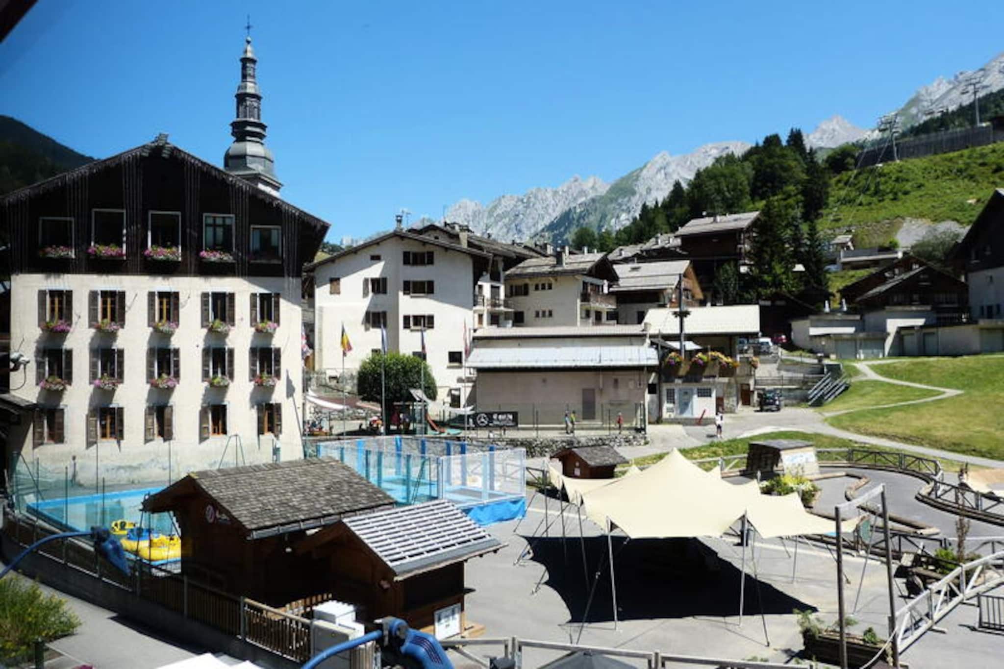 Property, along with its spacious layout, provides a luxurious and comfortable experience for up to 8 guests. This 118 m² duplex apartment features 3 large bedrooms, each with an en-suite bathroom, offering both privacy and convenience. The living room is equipped with a cozy seating area, a flat-screen TV with Chromecast, and a west-facing balcony, allowing guests to enjoy beautiful mountain views. The apartment also includes a private elevator that grants direct access to the living room and bedrooms. Though pets are not allowed, the property ensures maximum comfort with essential amenities, including Wi-Fi and a baby cot. The apartment is non-smoking and offers additional services such as bed linen, toilet linen, and departure cleaning, all included in the rental.

Located in the heart of the village, the apartment is ideally situated just 280 meters from the shuttle stop and steps away from various attractions. Guests can enjoy the ski slopes, the ice rink, and ski lesson departure points at Champ Giguet, making it an ideal location for winter sports enthusiasts. The property is also close to the two main cable cars, Patinoire and Beauregard, which provide easy access to the surrounding mountains. For leisure, guests can visit the spa of a 5-star hotel nearby or enjoy a meal at its gourmet restaurant. The apartment's central location allows guests to experience the best of the village, with shops and restaurants also within walking distance. The nearest transport connections are Annecy SNCF train station (32 km away) and the La Clusaz bus station (280 meters).

The apartment boasts a fully equipped open kitchen with modern appliances, including an American fridge, oven, induction hob, microwave, dishwasher, Nespresso coffee machine, and a wine cellar. For added convenience, a laundry room with a washing machine and dryer is provided, along with a ski boot dryer. Guests also have access to a ski rack and two parking access cards for the winter season. The apartment's design ensures comfort and style, with large windows offering stunning views of the slopes and the Aravis mountain range. Additional features include electric heating, a ski rack, and easy access to nearby restaurants and shops. The private elevator further enhances the convenience of the layout, ensuring seamless access to the apartment's various levels.