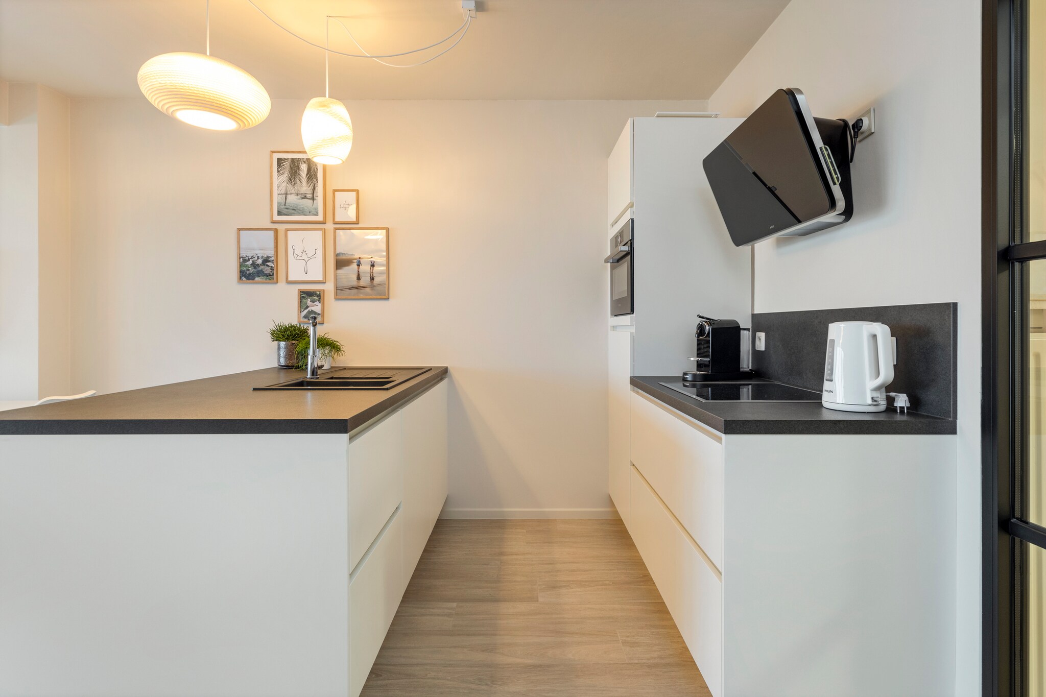 On the 5th floor: (hall(toilet), Living room(TV, dining table, seating area), Kitchen(hob(electric), electric kettle, toaster, hood, coffee machine, oven, microwave, dishwasher, fridge-freezer), bedroom(double bed(two single duvets, 180 x 200 cm)), bedroom(double bed(two single duvets, 160 x 200 cm)), bathroom(shower, washbasin), Internet access)\n\ntumble dryer, washing machine, balcony or terrace, parasol, lift, ironing board, iron