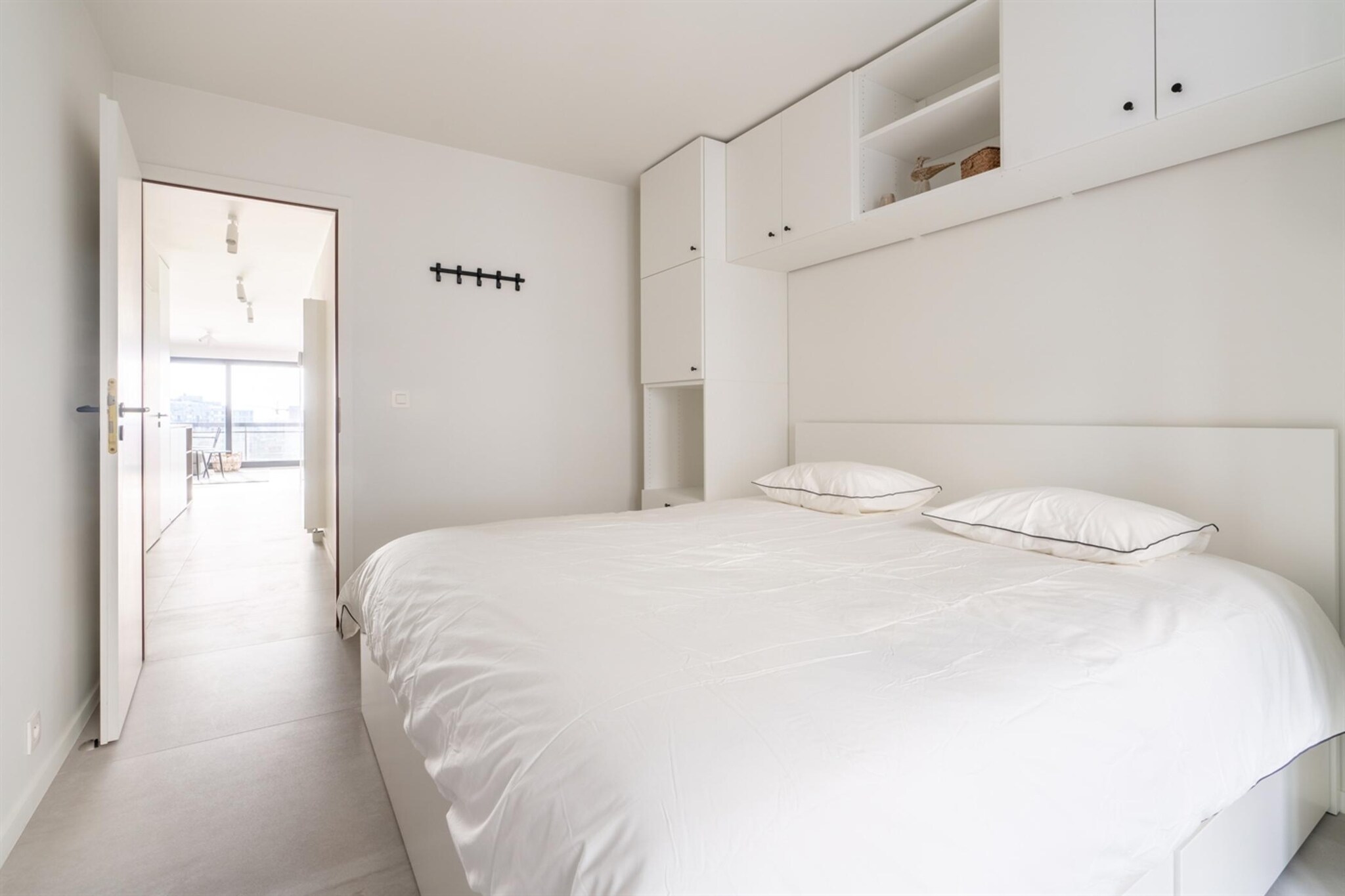 On the 7th floor: (hall(toilet), Living room(TV(flatscreen, digital), dining table, seating area), open kitchen(hob(induction), electric kettle, coffee machine, oven, dishwasher, fridge-freezer), bedroom(double bed(two single duvets, 160 x 200 cm)), bedroom(double bed(two single duvets, 160 x 200 cm)), bathroom(shower, washbasin, toilet), Internet access)\n\nstorage, balcony, heating(gas), terrace, garden furniture, lift, ironing board, iron