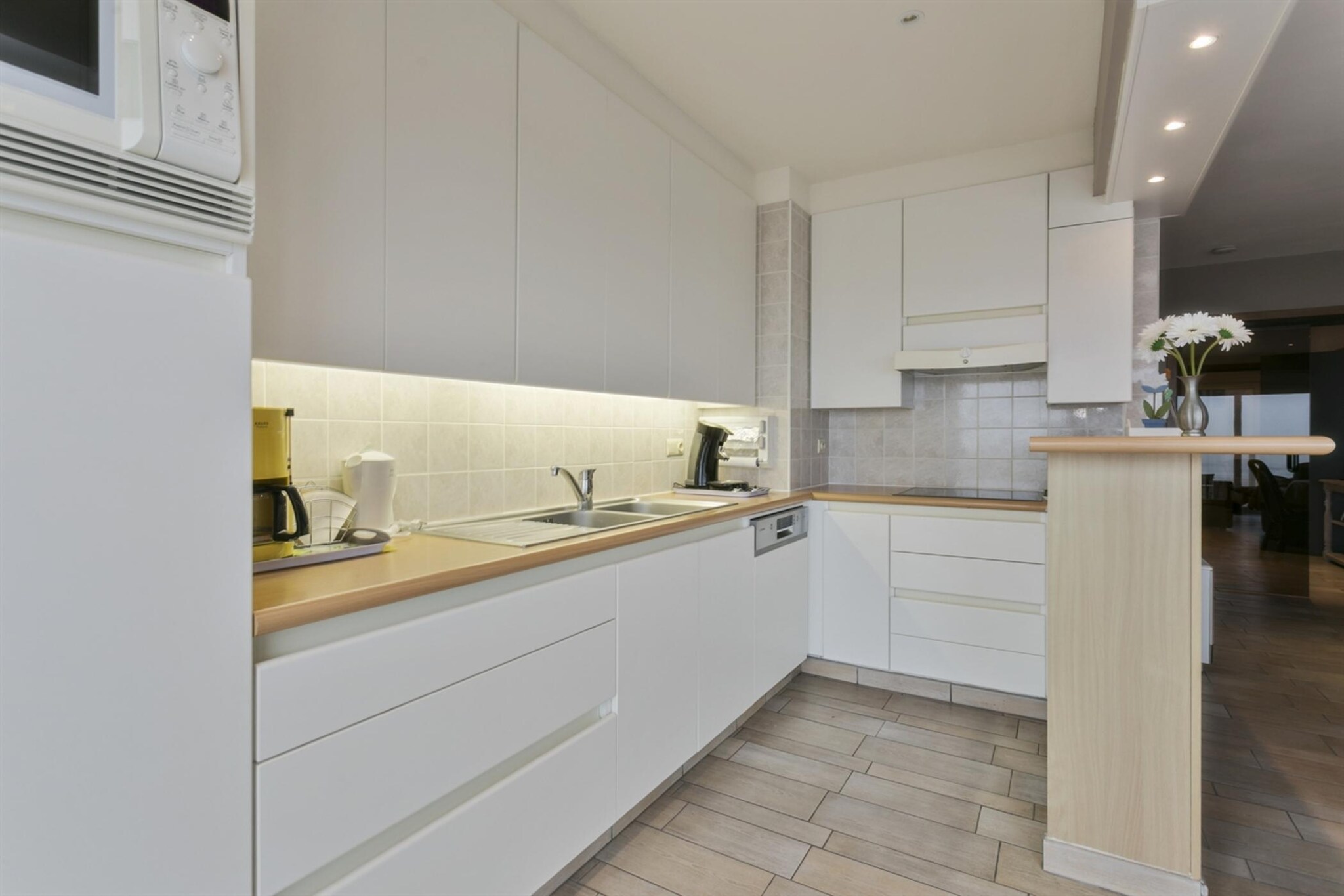 On the 1st floor: (Living room(double sofa bed(160 x 200 cm), TV(flatscreen, digital), dining table, seating area, DVD player), open kitchen(hob(ceramic), electric kettle, coffee machine, microwave, dishwasher, fridge-freezer), bedroom(single bed(90 x 200 cm), single bed(90 x 200 cm)), bedroom(single bed(90 x 200 cm), single bed(90 x 200 cm)), bathroom(shower, washbasin, hairdryer), hall(toilet), Internet access)\n\nwashing machine, heating(electric), terrace, garden furniture, lift, ironing board, iron