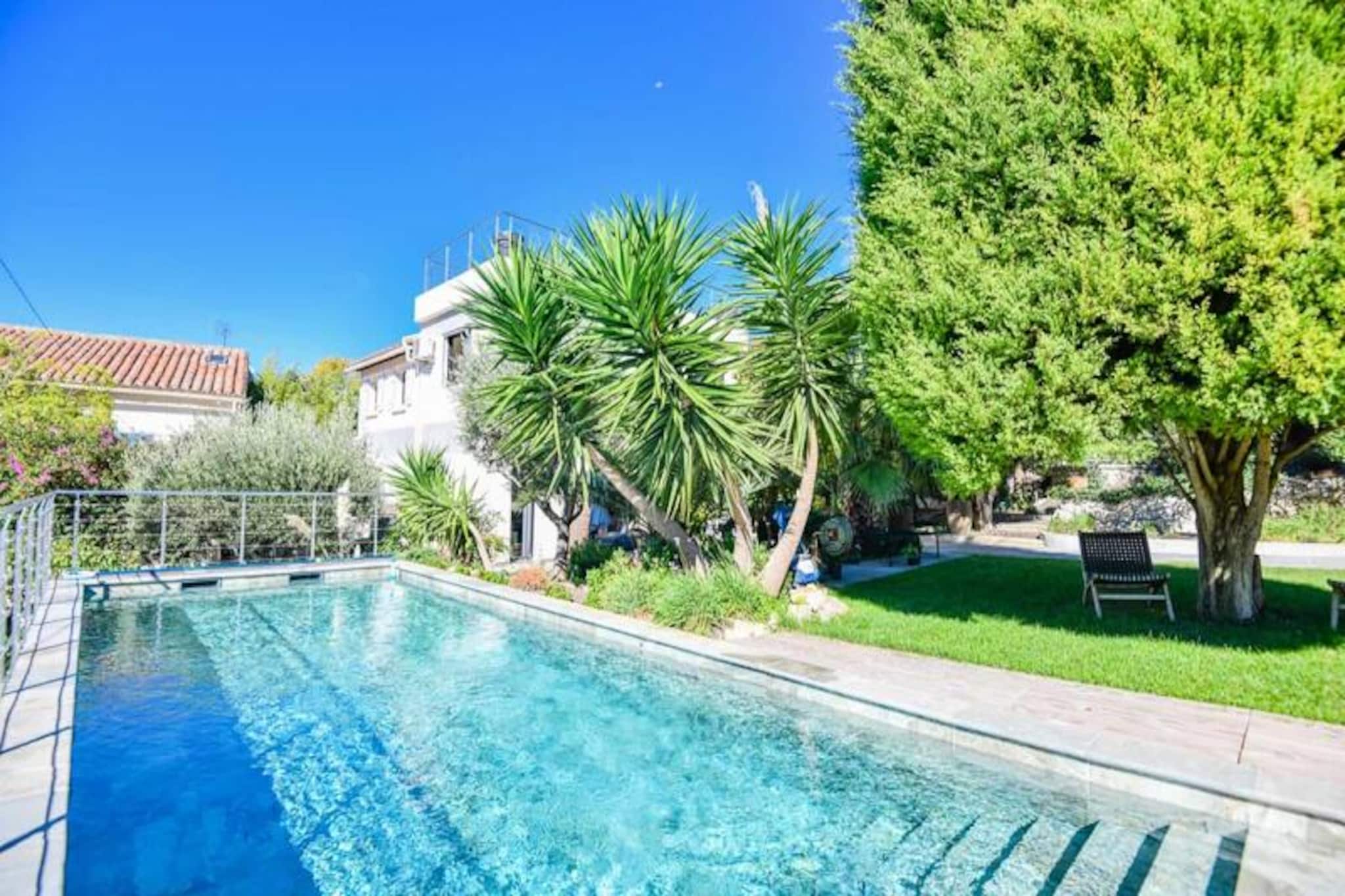 This stunning architect-designed villa, nestled in the tranquil heights of Roucas Blanc in Marseille, offers an exceptional vacation experience with high-end finishes and meticulous design. With a private swimming pool, a solarium, and breathtaking views of the Mediterranean Sea and the Notre-Dame de la Garde basilica, this villa is an ideal choice for those seeking both luxury and comfort. The spacious 200 m² property includes 4 beautifully furnished bedrooms, 2 modern bathrooms, and a fully equipped kitchen. The living areas are tastefully designed with quality furniture, and the villa comes with all modern amenities, including reversible air conditioning, a plancha, a washing machine, and a dryer.

Situated in the prestigious 7th arrondissement, this villa is only a 20-minute walk from the Old Port of Marseille and 1.5 km from the popular Catalans Beach. You’ll be able to immerse yourself in the vibrant life of the city, visiting museums like the Mucem and Cantini Museum, exploring the local markets, or enjoying the nearby beaches. The famous Notre-Dame de la Garde Basilica is just 500 meters away, while other iconic landmarks such as Fort Saint Jean, Palais du Pharo, and La Corniche are within easy reach. Local shops, including grocery stores, butchers, and wine cellars, are within walking distance, adding to the convenience and charm of the location. Whether you are relaxing by the pool, taking in the panoramic views, or exploring the cultural richness of Marseille, this villa offers the perfect base for your stay.