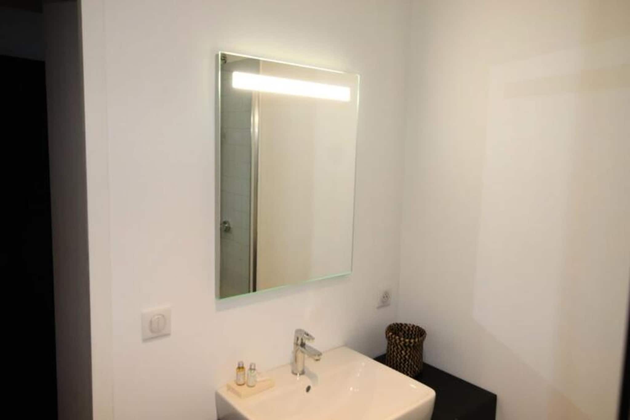 This beautifully renovated 55 m² apartment is located on the 4th floor of a historic building in Bordeaux's prestigious Golden Triangle. Its cozy and urban atmosphere is perfectly suited for a comfortable stay, offering a bright living room with an equipped kitchen, a relaxing sofa, and armchairs. The two bedrooms are thoughtfully furnished, one with a double bed and ample storage, the other with a sofa bed for two. The modern bathroom features a walk-in shower, sink, and towel dryer, with a separate toilet for added convenience. Enjoy a stunning view of Bordeaux's rooftops, along with reversible air conditioning for comfort.

The apartment's prime location places you steps away from Bordeaux's vibrant heart, offering easy access to luxury shops, Michelin-starred restaurants, and local favorites like Le Noailles brasserie. Explore nearby attractions such as the Bordeaux Museum of Fine Arts, the beautiful public garden, and the iconic Place de la Bourse. Stroll through the historic district, where landmarks like the Palais Rohan, Saint-André Cathedral, and Pey-Berland Tower await. Whether you’re visiting for culture, shopping, or dining, everything is within walking distance.