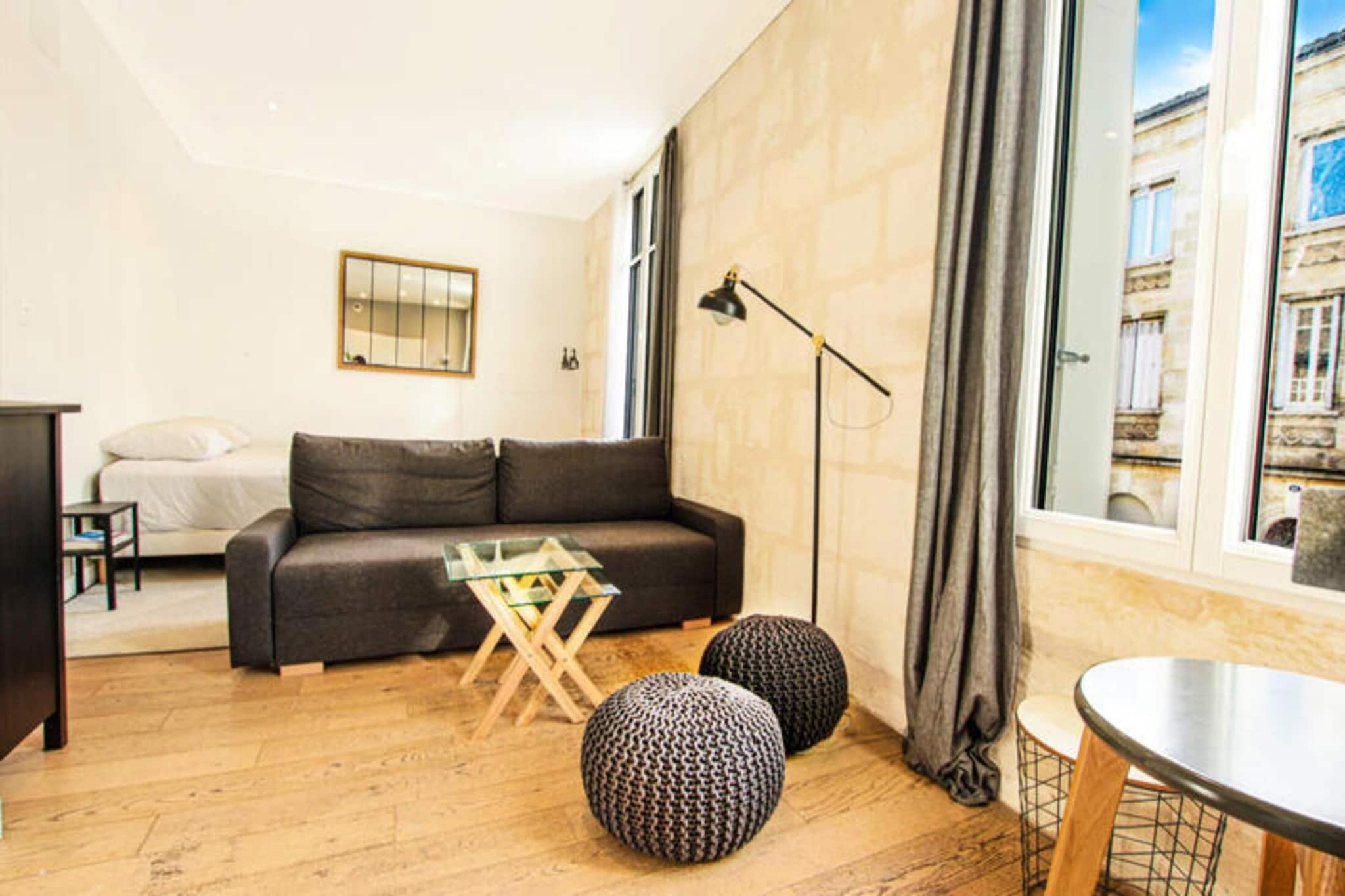 Located in the vibrant heart of the Chartrons district, this charming 35 m² studio offers an ideal retreat for those looking to experience Bordeaux's historic charm while enjoying modern comforts. Completely renovated, the apartment combines the authenticity of Bordeaux stone with contemporary elegance, featuring beautiful parquet flooring that adds warmth to the space. The kitchenette is fully equipped with an oven, fridge, coffee machine, toaster, and all necessary utensils, allowing you to easily prepare meals during your stay. The bathroom has been thoughtfully designed for both functionality and style.

With air-conditioning and a secure building, this studio offers a peaceful and comfortable environment. Personalized concierge services and an optional breakfast ensure a smooth start to your day. Situated on Cours de la Martinique, the apartment is perfectly placed to explore the Chartrons district, known for its lively atmosphere and rich history. You’ll be just a short walk from various tram and bus lines, making it easy to access Bordeaux’s city center and its attractions.

The Chartrons district is renowned for its mix of historic architecture, trendy shops, and local markets. A visit to the Quai des Marques for shopping, cafes, and views of the Garonne River is a must. Wine enthusiasts will enjoy the nearby International Wine Museum, while the iconic Jacques Chaban-Delmas Bridge and the picturesque riverfront are perfect for leisurely strolls. This area offers the perfect blend of history, culture, and modern charm, making it a wonderful place to stay and explore Bordeaux.












