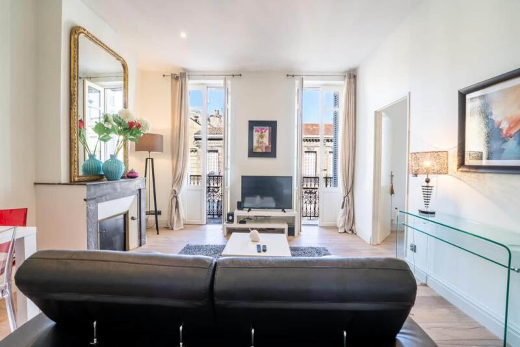 Located in the heart of Bordeaux’s historic Saint-Michel district, this elegant apartment offers a perfect blend of comfort and style. Housed within a charming historic building, it boasts an ideal location with easy access to Bordeaux's cultural and lively events. The apartment is just a short walk from the iconic Basilica of Saint-Michel and its bell tower, a prominent feature of the district. Nearby, Place des Capucins hosts Bordeaux’s largest and oldest market, offering a rich mix of history, local traditions, and vibrant market life. This area is perfect for history enthusiasts, food lovers, and those seeking to explore local culture.

The apartment’s living room, inspired by the sophistication of the 1920s, features a leather sofa, flat-screen TV, and high-speed internet, with three large French windows opening onto a private balcony. The adjacent dining area seats four and creates a lovely space for meals. The kitchen is fully equipped with modern appliances, including an oven, microwave, fridge, dishwasher, and a Nespresso machine, making it ideal for preparing meals during your stay. The bedroom includes a comfortable 160x200 cm bed with a memory foam mattress, while the bathroom features a shower and essential amenities.

Bordeaux is a UNESCO World Heritage Site, with attractions such as its scenic vineyards, the modern Place de la Bourse, and charming local bistros and restaurants. The apartment is well-connected by public transport, with tram stops nearby, and is perfect for those looking to immerse themselves in the city’s vibrant culture, historic charm, and exquisite food and wine.





