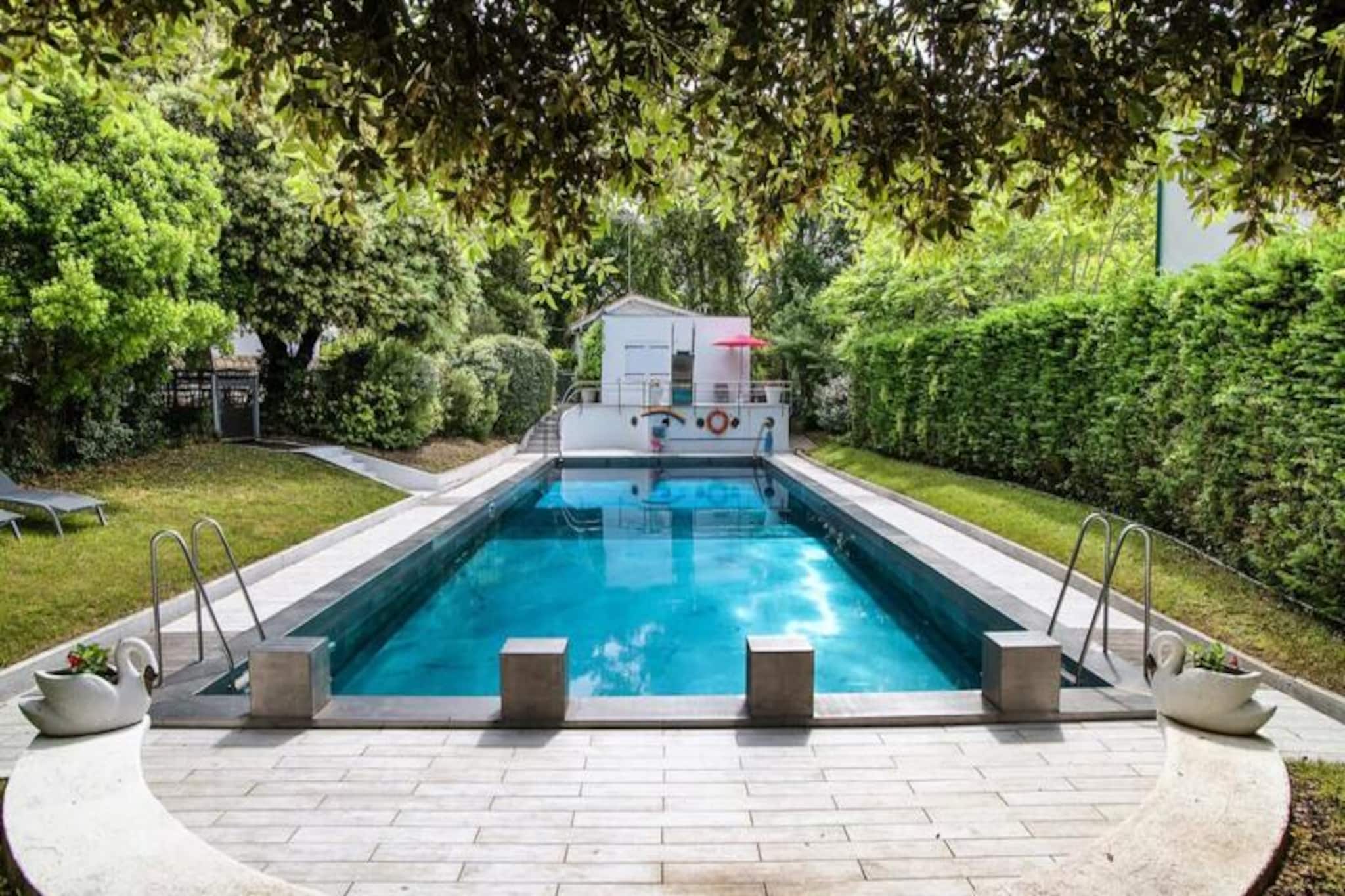 This stunning Arcachon villa offers over 300 square meters of living space and timeless elegance with its early 20th-century architecture. With its grand design and luxury features, this property offers a serene retreat with direct access to Perreire Beach, just 300 meters through a shaded path. The property boasts a vast garden of over 2200 m², a modern stainless steel swimming pool (open seasonally), and an expansive terrace with comfortable seating, a gas plancha, and BBQ for hosting guests or relaxing with family.
Inside, the villa offers a blend of traditional design and modern comforts. The ground floor is home to a spacious living area, a large kitchen with all necessary amenities, and a dining area enclosed by charming bay windows. Upstairs, the master bedroom features a private balcony with stunning sea views. The property has five well-appointed bedrooms, with individual bathrooms and thoughtfully designed spaces perfect for multi-generational families or groups. Additional features include a youth floor with marine-style features, play areas, and a laundry room with all the modern equipment needed for a stress-free vacation.
Arcachon’s village center is just a 15-minute walk, offering quaint cafes, restaurants, and shops. The nearby tennis club, La Thalasso, and local golf courses provide additional activities for guests. With bike paths connecting the nearby areas, exploring Arcachon by bike or the famous EHO electric buses is a great way to experience this iconic coastal town.