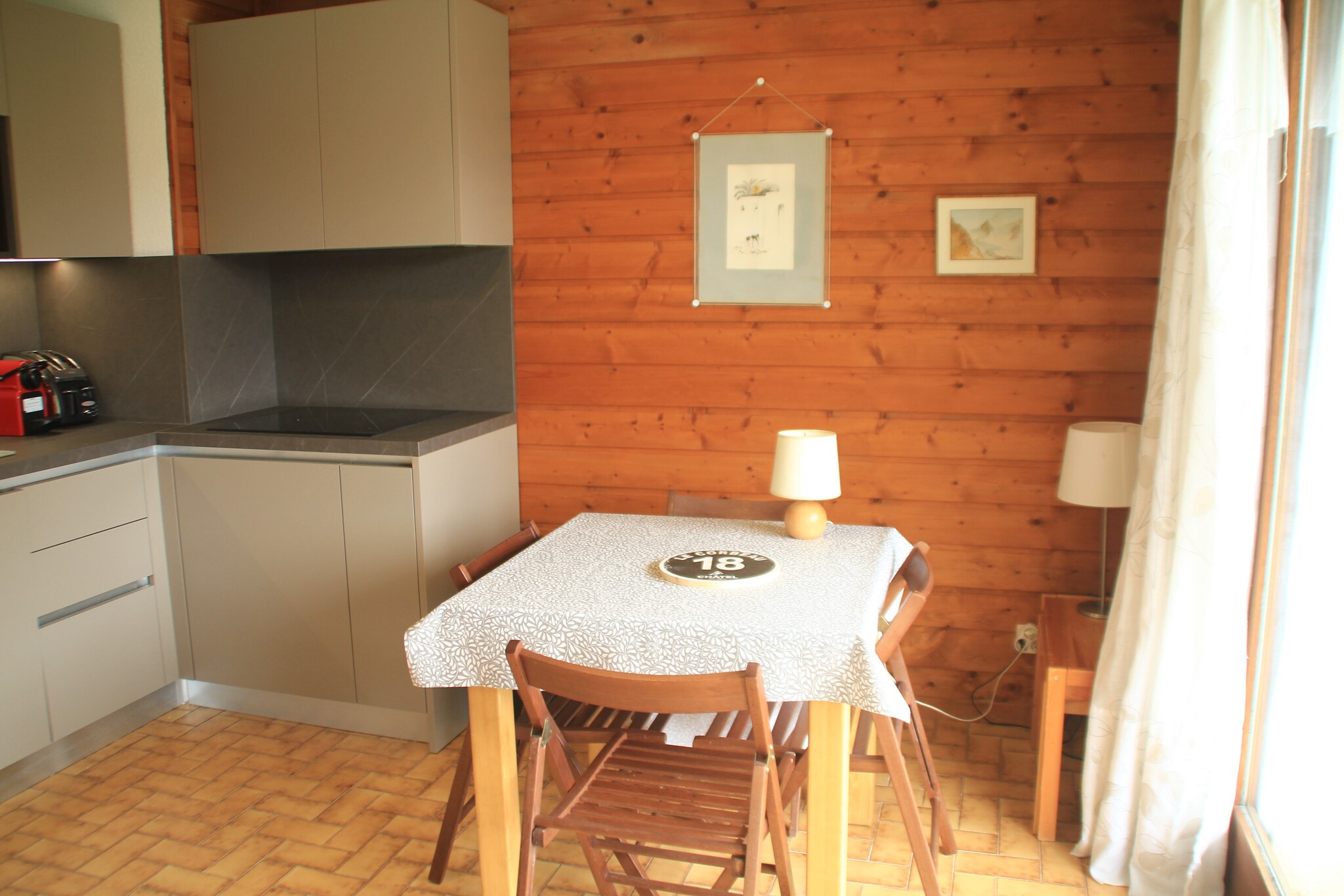 This charming ground-floor apartment offers a cozy retreat for up to 4 guests, with a compact yet comfortable 23 m² living space. The apartment features a sunny living room with a double sofa bed and a mountain corner with bunk beds, making it ideal for small families or groups. Guests can enjoy the stunning views of the Abondance Valley from the private terrace. Additional conveniences include a shared ski locker, an outdoor parking space suitable for small vehicles, and the option to bring pets, adding flexibility to your stay.
Located in the heart of Châtel, the residence offers a prime location just 400 meters from the nearest cable car, perfect for skiing and alpine exploration. Guests have easy access to local amenities, with shops and restaurants just 100 meters away. A free shuttle bus service nearby ensures seamless travel around the area. Nestled within the Portes du Soleil region, the property combines convenience and natural beauty, making it a perfect base for exploring the mountains.
The apartment’s modern kitchen is equipped with a ceramic hob, multifunction oven, fridge, dishwasher, Nespresso coffee machine, kettle, and toaster, allowing for effortless meal preparation. The bathroom includes a shower and a separate toilet for added convenience. Optional services, such as bed linen and towels, final cleaning, and a rentable mini Wi-Fi box, can further enhance the comfort of your stay. Guests can also benefit from the Portes du Soleil Multi Pass, offering access to numerous activities and discounts on tourist sites for a memorable alpine vacation.
Note: The tourist tax will be collected at the property and is not a part of rental.