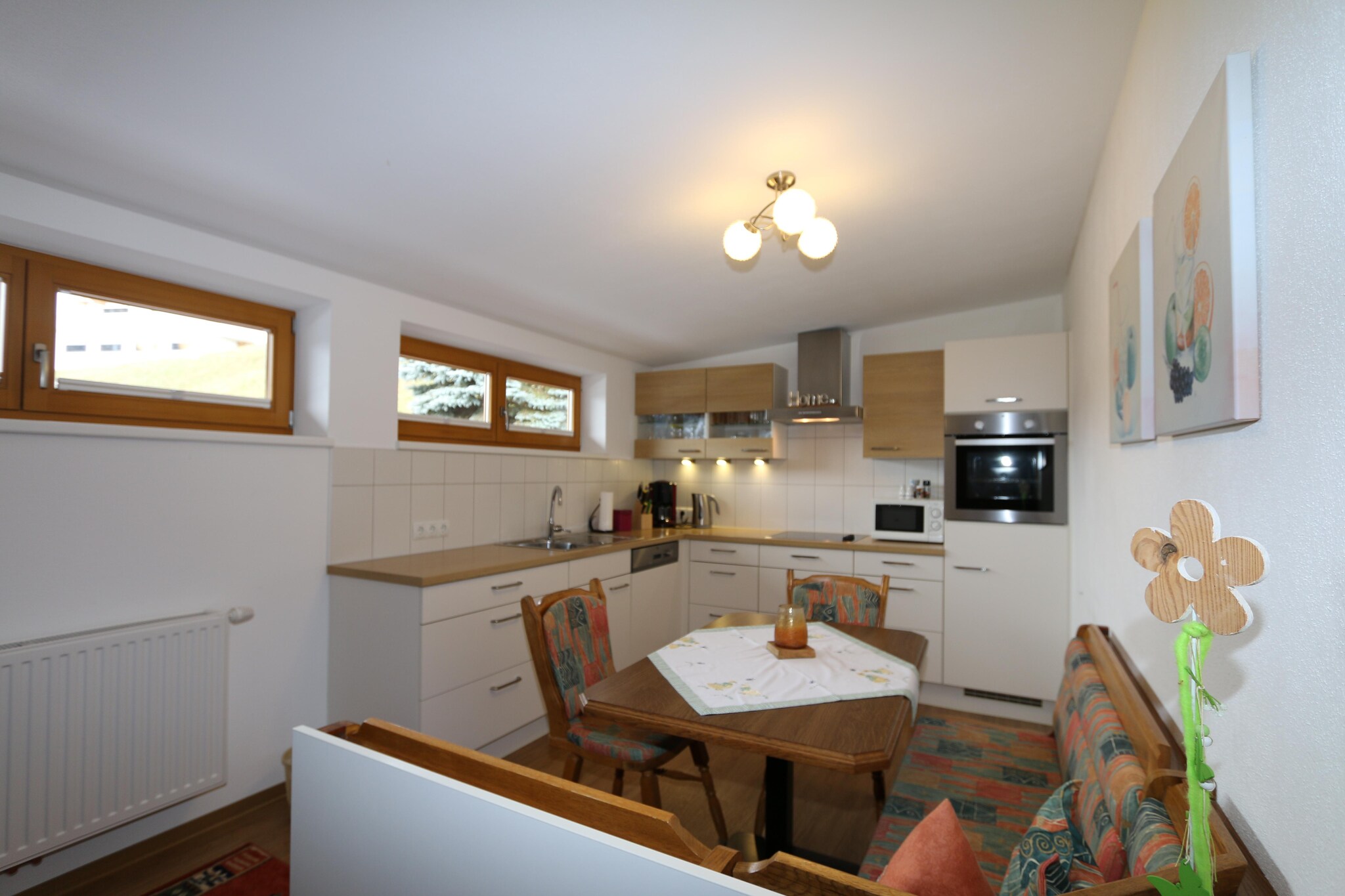 On the 2nd floor: (Kitchen(TV(satellite), dining table, hob(4 ring stoves, ceramic), electric kettle, coffee machine, oven, microwave, dishwasher, fridge(+ freezer)), Living/bed room(double sofa bed, TV(satellite), balcony), bedroom(double bed, washbasin), bedroom(double bed, TV(satellite)), bathroom(shower, toilet), balcony, garden furniture, parking)