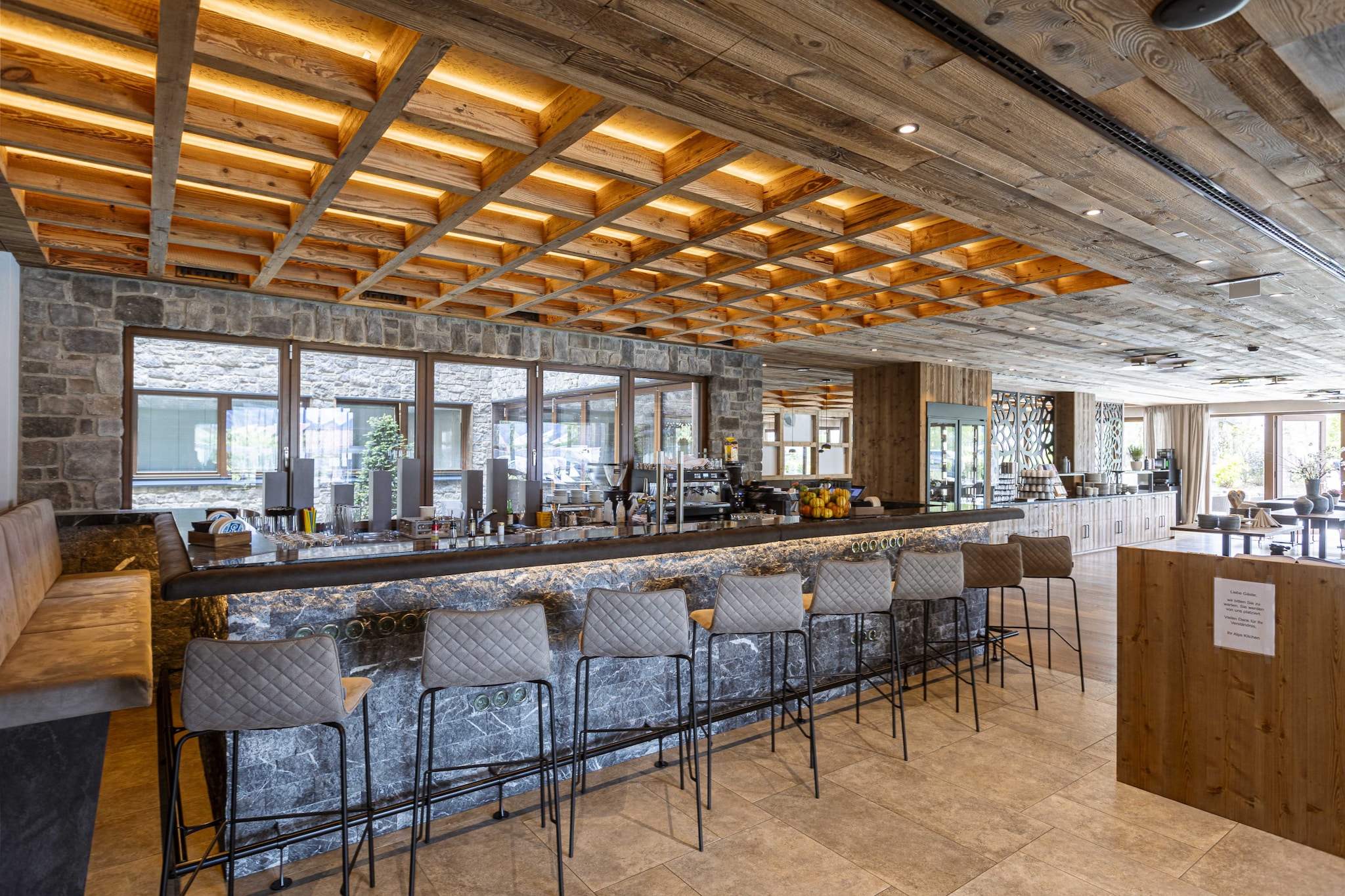 Bergresort Zugspitze Ehrwald offers the perfect accommodation for your vacation, including breakfast. The 47 to 64 m² apartments comfortably accommodate 2 to 4 people and feature one bedroom with a double bed and a bathroom with a shower and WC, along with a hairdryer. The living-dining area is equipped with a kitchenette, and a balcony adds extra comfort. The living area also includes a double sofa bed, providing space for 2 additional guests. The fully equipped kitchen has everything you need to prepare meals, including cutlery, cookware, a ceramic cooktop, microwave, refrigerator with freezer compartment, dishwasher, kettle, and a Nespresso coffee machine. A small starter kit with dishwasher tablets, dishwashing liquid, sponge, trash bags, cleaning cloths, and a dish towel will be provided upon your arrival.
Free Wi-Fi is available throughout the Bergresort Zugspitze Ehrwald. All images are sample images, as each apartment is uniquely furnished. Additionally, the resort offers a wellness area with a heated outdoor pool, saunas (bio-sauna, Finnish sauna, infrared sauna), a steam bath, and a fitness room. The restaurant caters to your culinary needs. The guest card "Zugspitz Arena Bayern-Tirol Card" is included, and you can also use a free underground parking space.