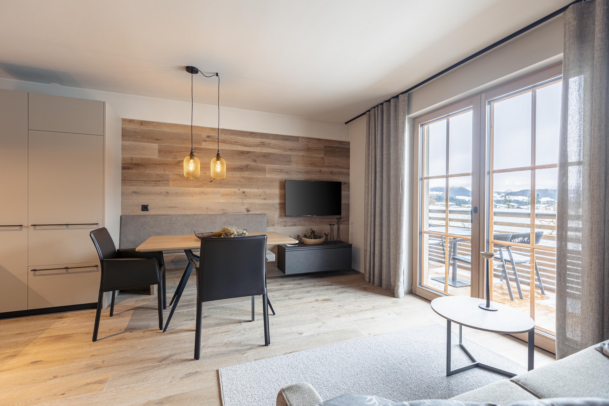 This modern apartment spans 60-70 m² and accommodates up to 4 people. It features 2 bedrooms with double beds, 2 bathrooms with showers, and a balcony. Additionally, the property includes a private infrared sauna for relaxation.

The Chalet is located in Westendorf, Brixental, in the Kitzbühel Alps. The Alpenrosenbahn ski lift is just 400 meters away, and the Kitzbüheler Alpen Westendorf golf course is 1 km from the property. A guest card is provided, offering access to various local discounts, and a free underground parking space is included.

The open kitchen is fully equipped with all the essentials: cookware and utensils, a ceramic hob, oven, dishwasher, fridge with freezer, toaster, kettle, and a filter coffee machine. A small starter kit, including dishwashing tabs, dishwashing liquid (sample), sponge, trash bags, cleaning, and dish towels, is provided upon your arrival. Free Wi-Fi and satellite TV are available, and a designated underground parking space is included for your vehicle during your stay. All images shown are example pictures, as each apartment is uniquely furnished.
