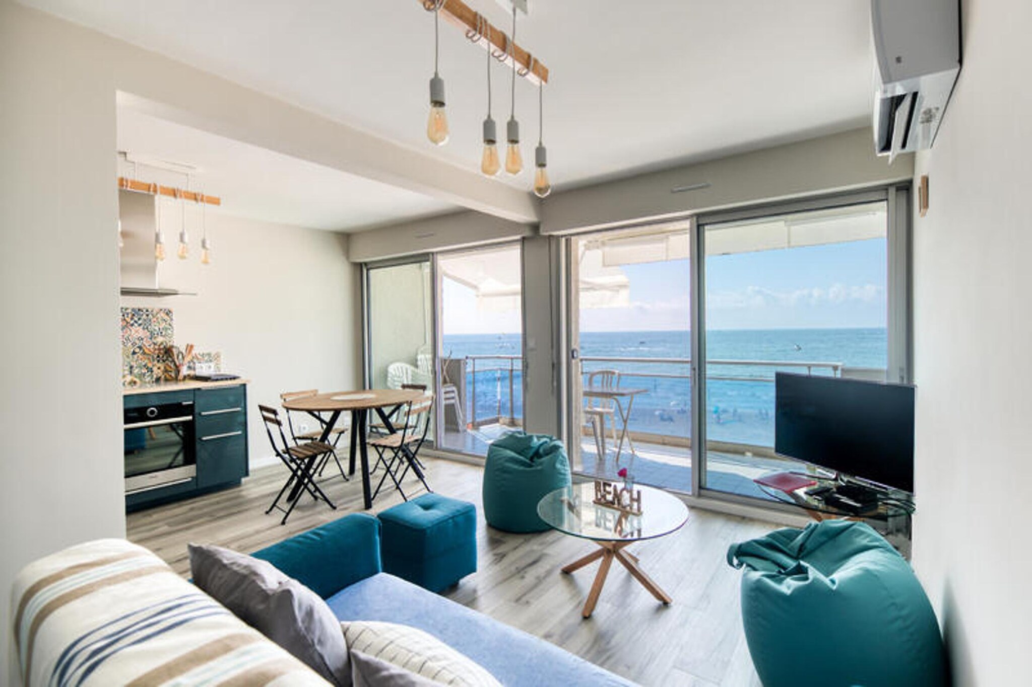 Facing the sea – First concierge service

Apartment 1 to 5 people – Palavas les flots, seaside

What a magnificent view! We couldn't call it anything else. 
A breathtaking view is the first feeling that invades you when you are in the apartment. Your eyes lose themselves in the infinity of the Mediterranean blue from your sofa and you say to yourself: How nice we are! Below, the beach, but you are privileged, you may go down there 

Because we want to relax in the apartment. A magnificent view, a terrace for relaxing “Facing the sea” in complete privacy. A kitchen that invites you to prepare the evening meal because this evening there is no need to go to the restaurant on the beach, the show is in front of you. A bedroom for the parents, a bedroom for the children, a sofa bed for friends who come to visit me. So I promise, I’ll go down for a swim later!

Nicolas and Alexandra entrusted us with their 65 m² apartment, fully air-conditioned. Kitchen, ceramic hob, extractor hood, washing machine, dishwasher, fan oven, microwave, coffee maker, kettle, fridge and freezer, table and chairs. Living room equipped with a television, high-speed wifi internet, large storage cupboard, convertible sofa (135cm wide) 1.5 places. Children's bedroom equipped with two beds (2x90cm wide) with drawers, desk. Parents bedroom equipped with a king size bed (160cm wide), large wardrobe. Bathroom equipped with a shower, sink, washing machine. Separate WC with hand basin. Fully air-conditioned apartment located on the 3rd floor with elevator. Municipal parking down the street.

We liked: its breathtaking view of the sea, a very beautiful renovation, excellent quality of equipment, a large terrace, elevator, air-conditioned apartment.

The apartment is equipped with every comfort. Free high-speed Internet. WIFI. Television. Bus, Bus line 131 Palavas, bus every hour to Montpellier. Car, Montpellier south motorway exit. Montpellier Méditerranée Airport 10 minutes away. Paid street parking. Please download “Waze” for your journey.

