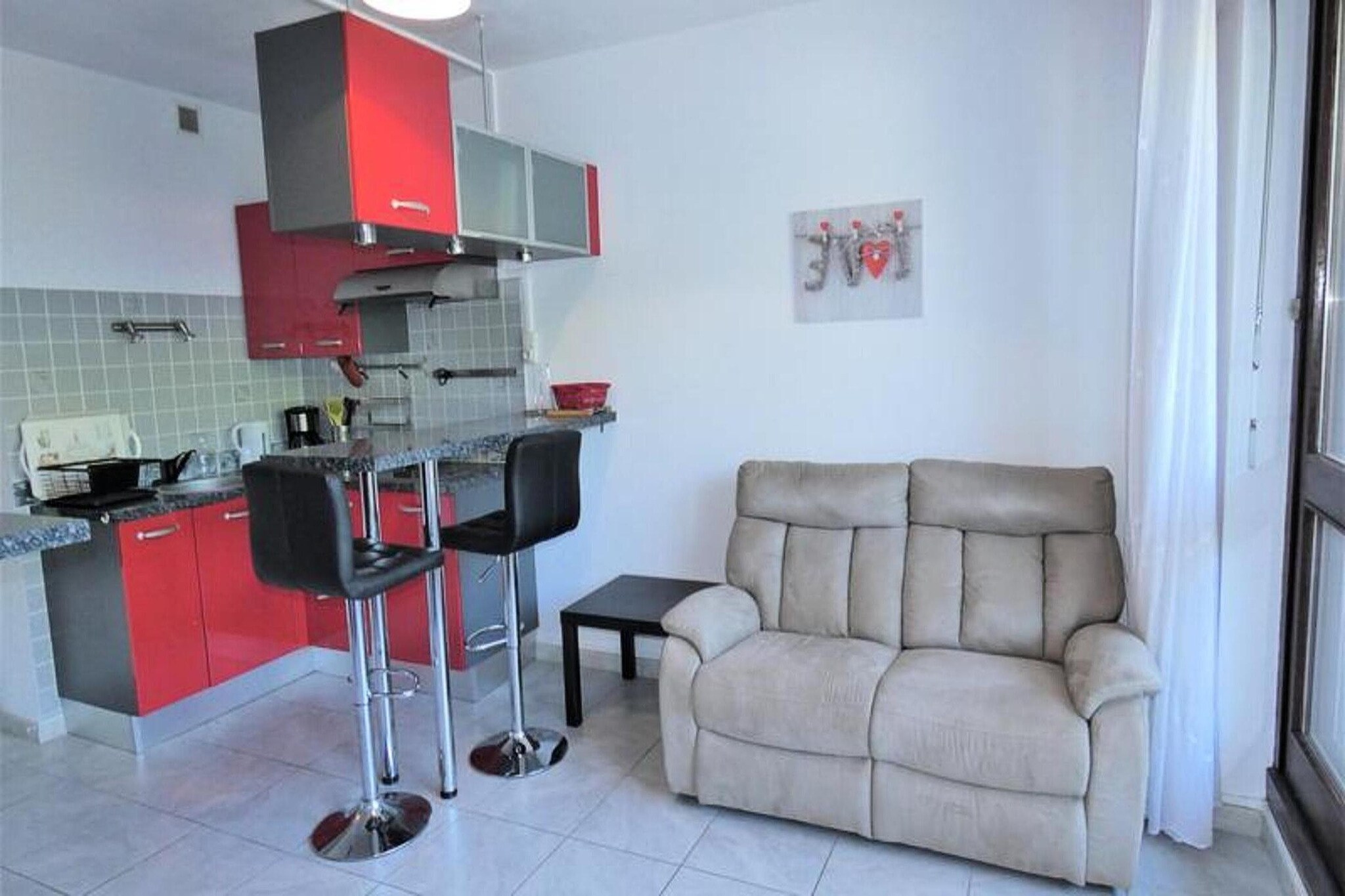 At 5, Rue des Goëlands in Aix les Bains
In co-ownership of several buildings from the early 1980s
Good quality building on the banks of Lake Bourget, in an ideal setting for an exotic stay.
It is located at the Petit Port, 2.5 km from the Tourist Office and the Casino, 3 km from the Chevalley Thermal Baths, 23 km from Mont Revard. (D9 on the map)
It consists of 4 floors with elevator. access to the main door is via a staircase (10 steps). Opening is done with a key or intercom.
Ideal location to enjoy the enchanting setting of Lake Bourget. Walk along the esplanade to reach the large port, or simply a moment of relaxation under the trees at the water's edge
Pleasant 2 room apartment in a quiet area by the lake
On the raised ground floor, in comfort range for 2 people
Classified as 2* furnished tourist accommodation for 2 people
Surface area of approximately 32 m², open to the East with furnished terrace
Entrance: (Tiled floor) Intercom - 1 wardrobe.
Living room (Tiled floor): East Balcony Access - 1 Sofa - 1 television unit - a small living room table, 1 wall-mounted flat screen television.
Kitchen area (tiled floor): 1 fridge/freezer, 3 hotplates, hood, 1 electric oven, 1 microwave, kettle toaster, electric coffee maker - 1 standing dining surface with 2 high stools, crockery and cookware.
Bedroom: (tiled floor): with east window - 1 140cm bed - 2 90cm bunk beds (only for teenagers), 1 shelf unit, 1 wall-mounted television - 1 bedside table with lamp.
Bathroom: (tiled floor): 1 shower with curtain - 1 vanity unit - 1 washing machine.
WC in the bathroom.
MISCELLANEOUS: individual electric heating, smoke detector - Column fan.
Animals not tolerated-
Parking space (visitor space) in the co-ownership and a few spaces outside the co-ownership.
This accommodation is not equipped with Internet access, you can go to different public places.
You can consult the link www.aixlesbains.fr.../Wi-fi-gratuit-de-la-ville
Additional services at extra cost: end-of-stay cleaning, bed linen, bathroom linen, pets, baby bed (subject to availability on request).
Deposit (in euros) - 500
Heating - 1