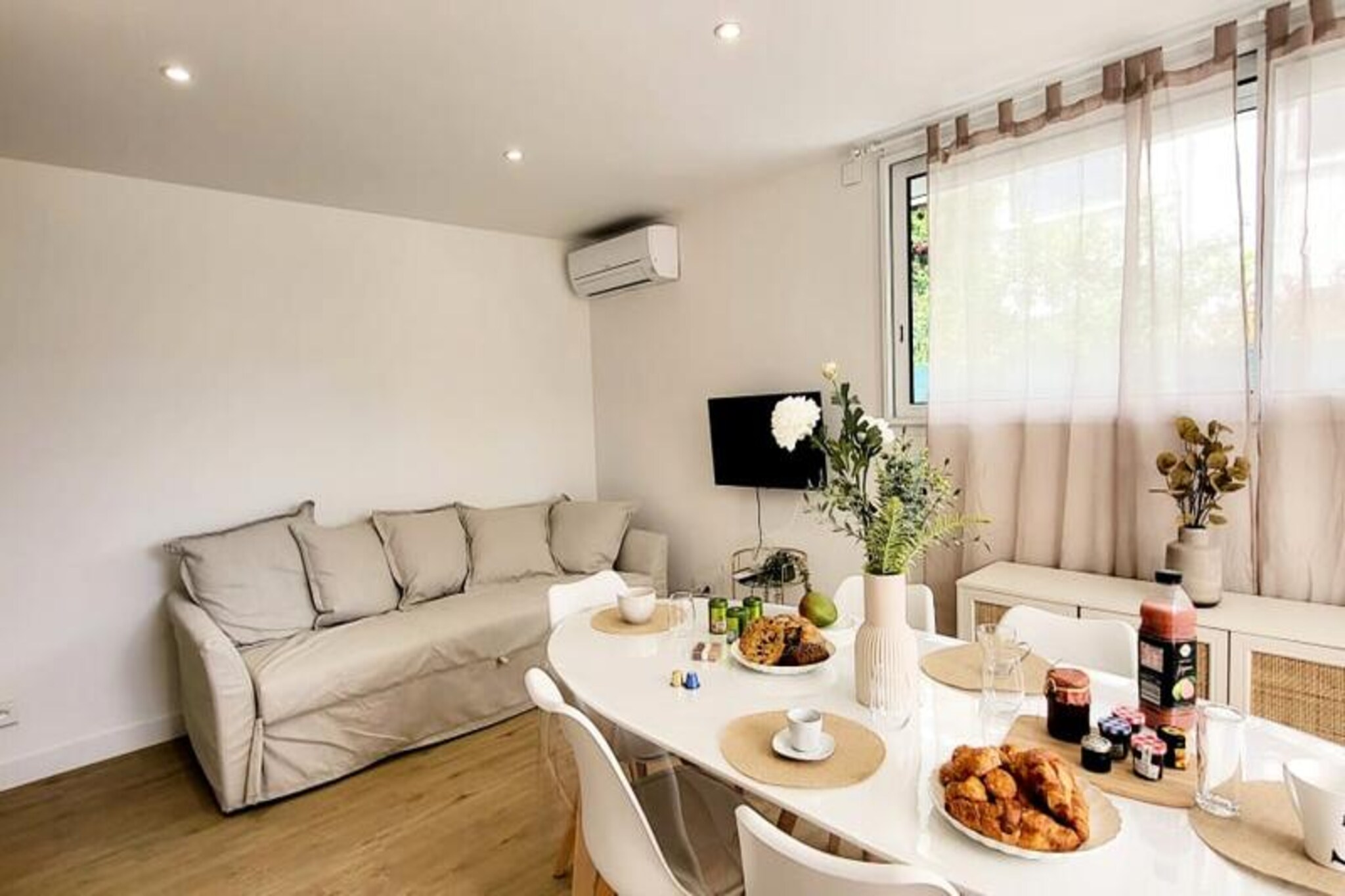 This beautifully renovated apartment offers a comfortable stay with two bedrooms, each featuring a 160 cm bed with soft pillows and duvets. Located on the ground floor of a closed residence, it provides a peaceful retreat just 300 meters from the beach and local shops. The apartment is air-conditioned and includes Wifi for added convenience. Pets are not allowed, ensuring a calm and quiet environment for all guests. With parking available on-site or in the street, it's easy to explore the surrounding area on foot.
Located in the quiet Town Hall district, the apartment is just 500 meters from Boucanet Beach promenade, where guests can enjoy stunning sunsets and Mediterranean views. The nearby fishing port offers a glimpse of local life, with trawlers passing through the canal and sales stalls along Quai Colbert. Port-Camargue, 1 km away, is Europe’s first marina and a hub for yachts and sailboats. Visitors can also enjoy local cafés, markets, and vineyards nearby.
The open-plan living room leads to a large bay window with access to a terrace, perfect for meals or relaxing in the garden. The fully equipped kitchen includes two induction burners, oven, microwave, fridge, freezer, dishwasher, washing machine, Nespresso coffee maker, toaster, and kettle. The shower room features a vanity unit with drawers, and a separate toilet for convenience.