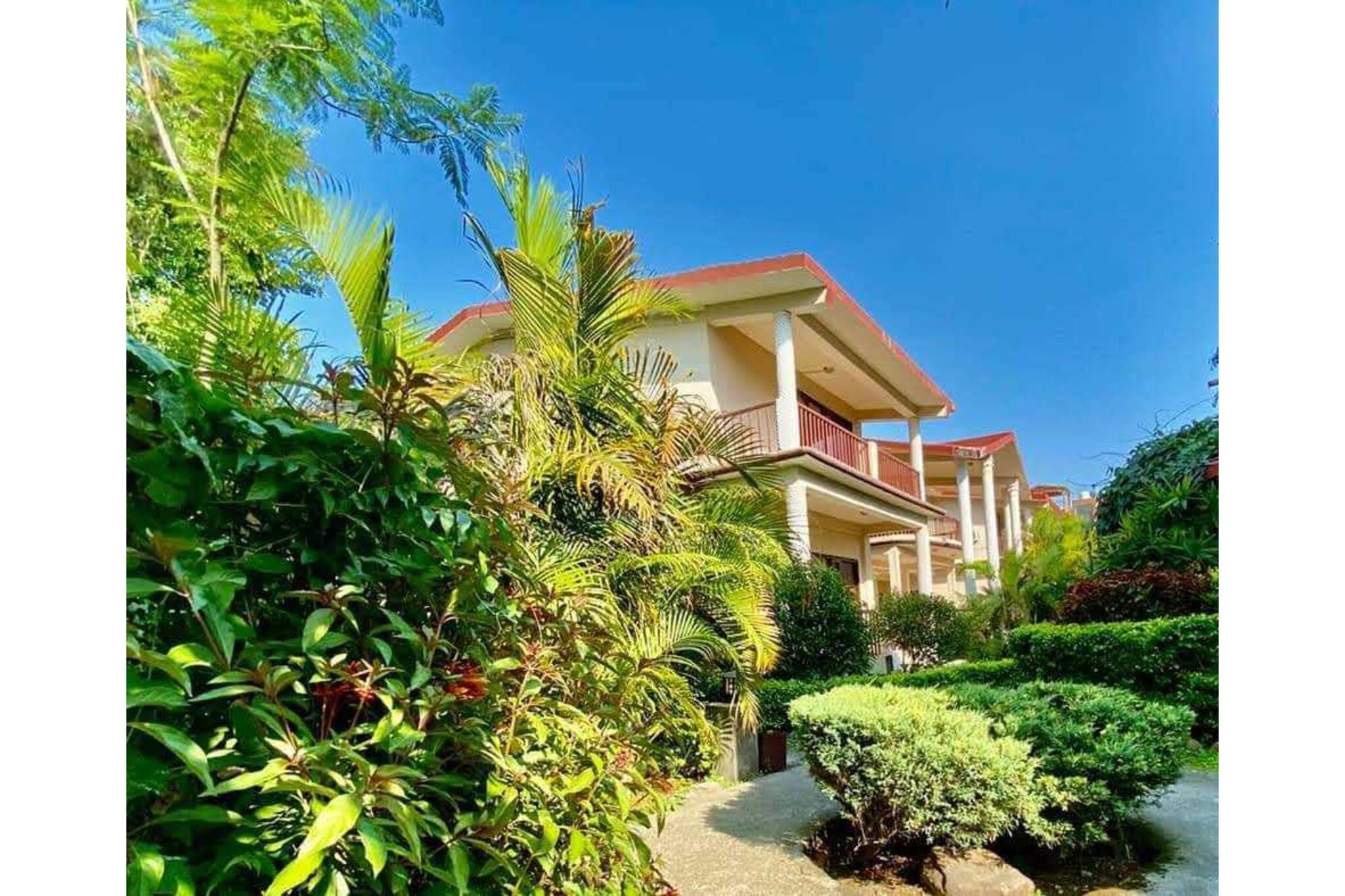 Ground floor: (Living room(seating area), Kitchen(electric kettle, microwave), bedroom(double bed, TV), bathroom(shower, washbasin, toilet))\n\npatio, garden