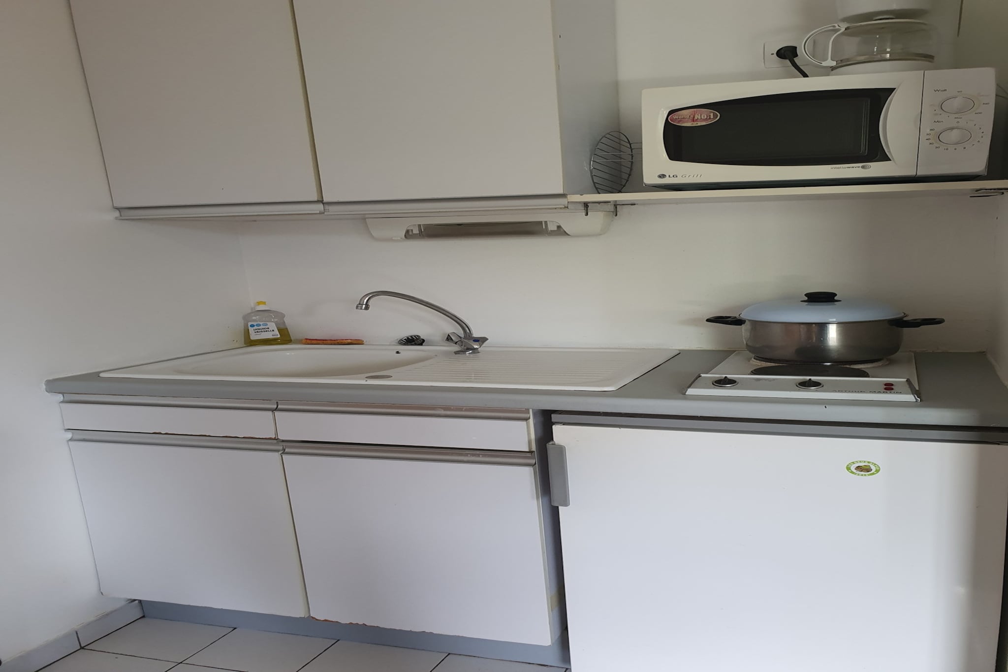 Living room(single sofa bed, single sofa bed, bunk bed), Kitchen(TV, coffee machine, microwave, fridge, dishes and cutlery), bedroom(double bed), bathroom(bath tub), balcony