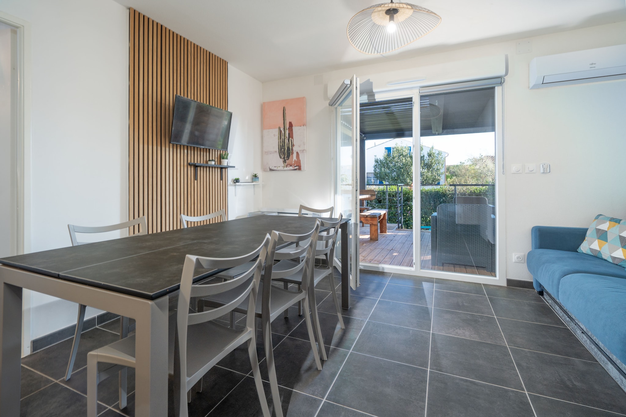 This bright and welcoming 70 mÂ² villa in Valras-Plage is ideal for families or groups of up to 9 guests. With 3 comfortable bedrooms and a location just 450 meters from the sandy beach, it offers the perfect blend of space, convenience, and coastal charm. A nearby restaurant and supermarket (1 km) add to the ease of your stay in this peaceful, family-friendly area by the sea.

The villa features a private garden with outdoor furniture, a terrace, and a barbecueâ€”perfect for enjoying meals under the sun or relaxing in the fresh sea breeze. Guests benefit from thoughtful amenities including air conditioning, electric heating, a washing machine, iron, hair dryer, and access to a communal heated swimming pool. Open-air parking within the building ensures hassle-free arrivals.

Inside, the open-plan electric kitchen is fully equipped with a refrigerator, microwave, oven, freezer, dishwasher, coffee machine, kettle, and all essential utensils. Whether you're preparing a quick breakfast or a full dinner, everything is at your fingertips for a smooth and enjoyable seaside holiday.