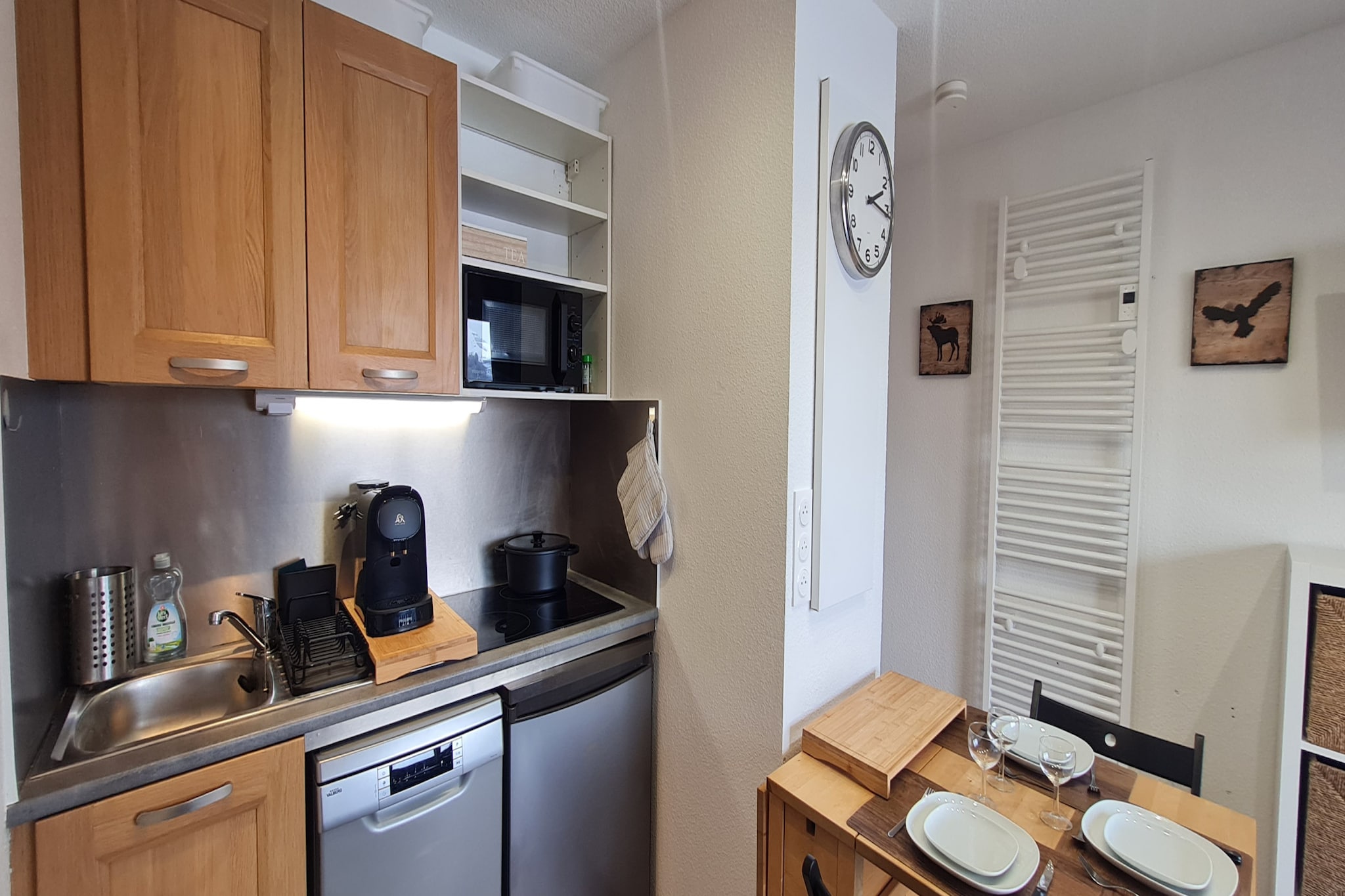 Living room(double sofa bed, TV), Kitchen(electric kettle, toaster, coffee machine, microwave, dishwasher, fridge, dishes and cutlery), bedroom(single bed, single bed), bathroom(shower, hairdryer), Internet access, washing machine, balcony
