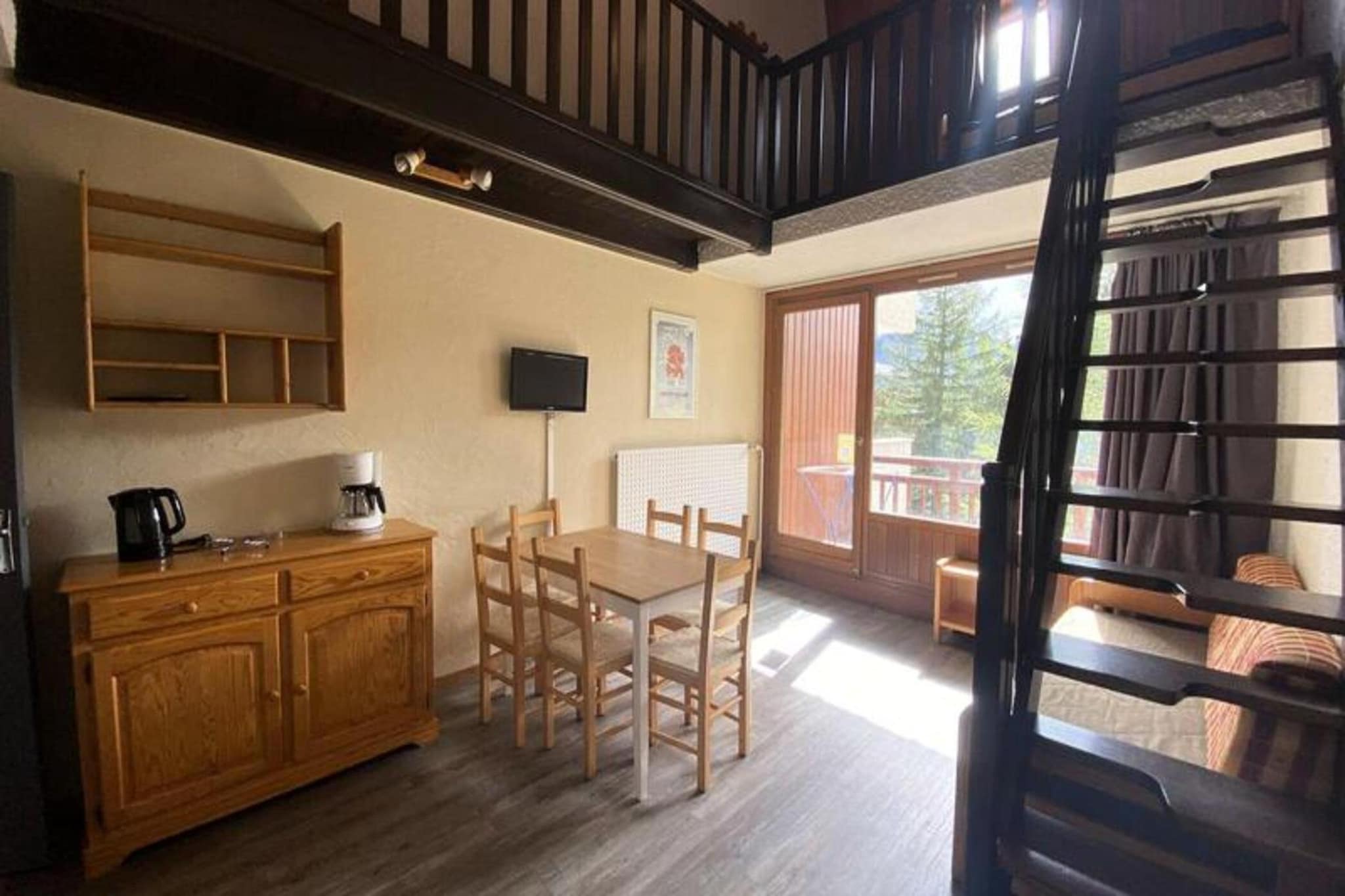 
This charming duplex apartment, spanning 43m² with an additional 18m² under the slope, accommodates up to 6 guests, making it ideal for families or small groups. The ground floor features a cozy living room with a convertible sofa, a mountain corner with two single bunk beds, and a south-facing balcony offering stunning mountain views. Upstairs, there’s a sleeping area with a single bed and another with a double bed and a single bed, providing ample space for restful nights. This property includes a private ski locker and is not pet-friendly, ensuring a serene and comfortable stay.

Nestled in the vibrant heart of the Deux Alpes resort, this apartment offers unbeatable proximity to key attractions. Located in the center of the 1800 village, the property is close to the Jandri 1 & Express ski lifts, ESF ski school, and local shops, all within walking distance. Guests can enjoy easy access to nearby cafes, markets, and restaurants, perfect for après-ski relaxation or exploring the area’s culinary delights. Parking is conveniently available at the base of the building.

Designed for comfort and functionality, the duplex includes a fully equipped kitchen area, a bathroom with a separate toilet on the ground floor, and an additional separate toilet upstairs. Essential services, such as end-of-stay cleaning, are included, while bed linen and towels can be reserved upon request. Whether you're here for winter sports or a summer getaway, this property ensures a cozy and memorable experience.