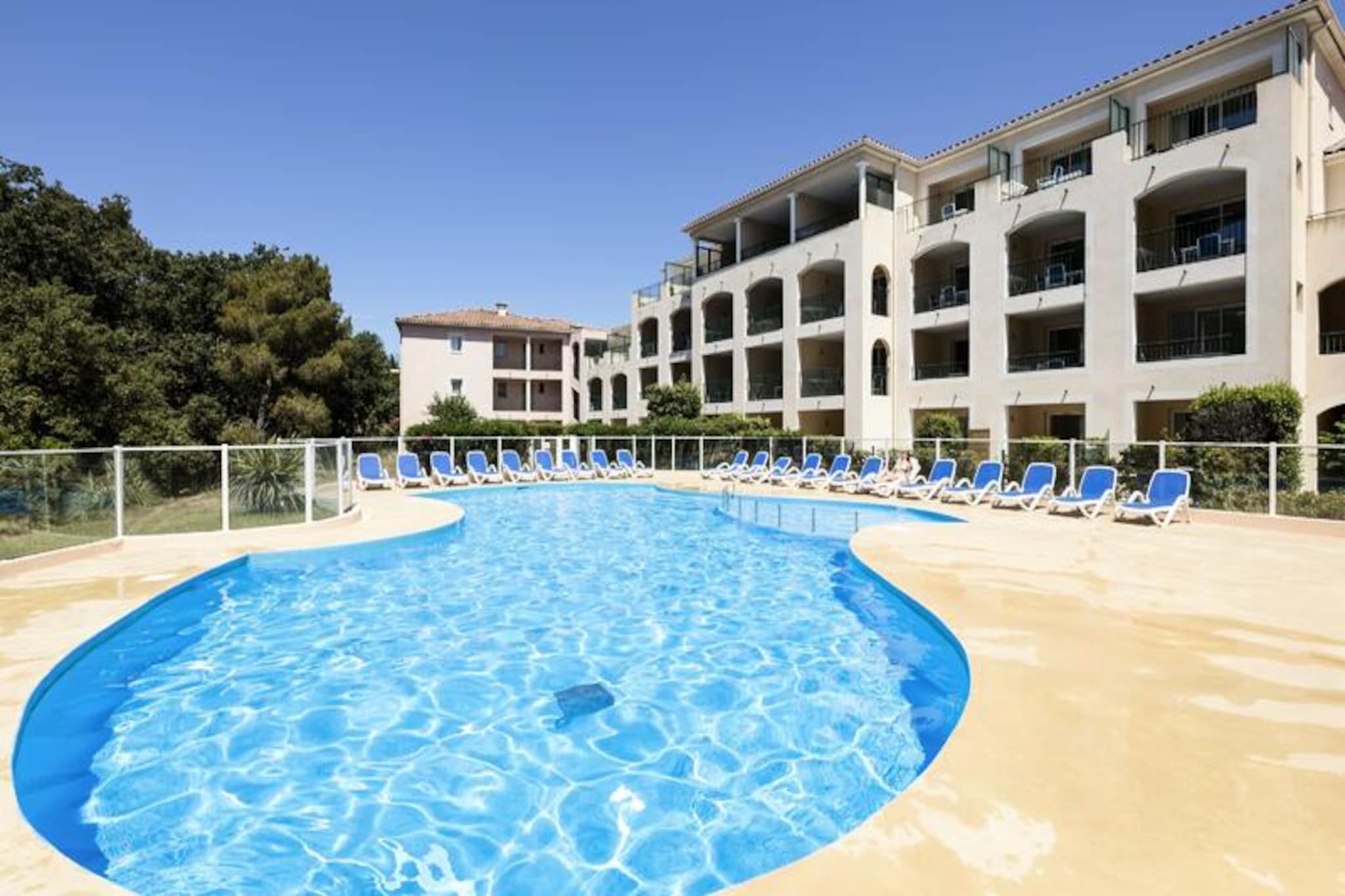 This charming apartment in Six-Fours-les-Plages offers a comfortable and inviting stay for up to 4 people. It features a living room with a pull-out sofa bed, a cozy cabin with a double bed, and a well-equipped kitchenette. The property is pet-friendly, with a small additional charge, so your furry friends can join you on your seaside getaway. A bathroom with WC is also included, and bed and bathroom linens are provided. Free Wi-Fi access is available throughout the accommodation, ensuring you stay connected during your visit.

Located just 350 meters from the beach and 1.5 km from the city center, the apartment offers easy access to a variety of nearby attractions. Explore the fine sandy beaches, marinas, and protected forests that make Six-Fours-les-Plages a popular Provencal destination. With cafes, restaurants, and markets nearby, you can enjoy local Mediterranean cuisine and fresh produce. The residence is nestled in a green setting, making it a perfect base for exploring the Mediterranean coastline between Bandol and Toulon.

The apartment comes with additional amenities to enhance your stay, including a private balcony or terrace. You can enjoy the outdoor heated swimming pool, open seasonally, or relax in the paddling pool. Free outdoor parking is available, along with covered parking spaces for added convenience. Optional services include a buffet breakfast, baby bed (on request), and a final cleaning package.