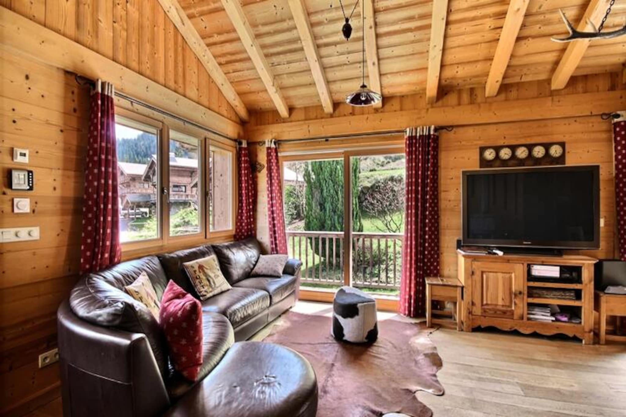 This spacious 200m² chalet accommodates 12 to 14 people, offering comfort and modern amenities for a family or group getaway. The chalet features multiple bedrooms, including a mix of double beds and single beds, ideal for a variety of sleeping arrangements. The cozy living areas include a leather sofa, flat-screen TV, and a dedicated space for video games. The property is pet-free and offers free Wi-Fi, making it perfect for a peaceful retreat without distractions. A private garden allows children to play safely, while a large outdoor terrace provides the perfect spot for relaxation.
Located at the foot of the slopes in the family-friendly Saint Jean d'Aulps resort, the chalet is just 300 meters from the ski lifts, making it an excellent choice for winter sports enthusiasts. The nearest shops, bars, restaurants, and a sports store are within walking distance, ensuring convenience throughout your stay. For those looking to explore further, the Portes du Soleil ski areas, including Morzine, Avoriaz, and Les Gets, are only a 15-minute drive or shuttle bus ride away. Enjoy the quiet charm of the area, with easy access to both outdoor activities and local attractions.
The chalet comes equipped with a fully functional kitchen featuring a ceramic hob, oven, microwave, and dishwasher, perfect for preparing meals. The living and dining areas offer ample space for guests to gather. Additionally, the chalet includes a laundry room with a washing machine and dryer, as well as a ski room for convenience. For families, a travel cot and booster seat are available. After a day of skiing or hiking, unwind with the raclette or fondue machines or enjoy a BBQ on the private garden terrace.