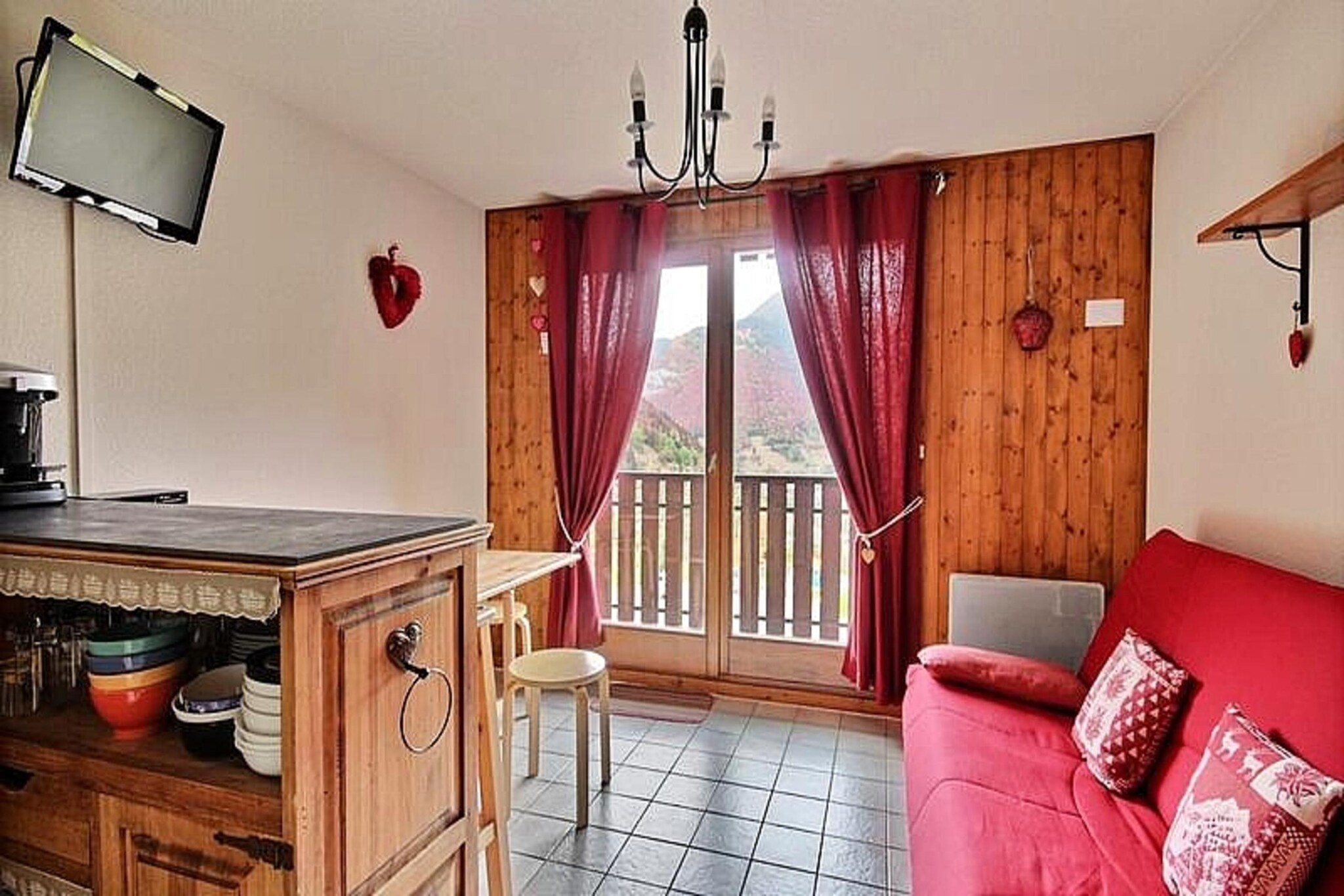 This cozy 20m² studio is designed for up to four guests, offering a comfortable retreat at the foot of the slopes in Saint Jean d'Aulps resort. The studio features a mountain corner with bunk beds, a separate toilet, and a bathroom with a shower and towel dryer. The living area includes a sofa bed, a TV, and a DVD player, providing a space to relax after a day of skiing. Please note that pets are not allowed, and Wi-Fi is not available. Bed linens and towels are not provided, but duvets and pillows are included for all beds.
The studio boasts a prime location just steps from the ski lifts, making it ideal for ski enthusiasts. Guests can enjoy stunning views of the surrounding mountains and valley from the south-facing balcony. Within walking distance, you'll find various cafes, restaurants, and shops, ensuring convenience throughout your stay. The resort's charm is amplified by its family-friendly atmosphere, and for those looking to explore more, the larger Portes du Soleil ski area is just a short drive away.
The well-equipped kitchenette offers 2 electric burners, a mini oven, microwave, and essential appliances like a kettle, toaster, and filter coffee maker, perfect for preparing simple meals. A folding dining table with stools provides ample space for meals. Additional amenities include a raclette machine, fondue maker, and a cellar for extra storage. Heating is provided through electricity, ensuring a warm and comfortable environment. The property also offers collective parking for your convenience.