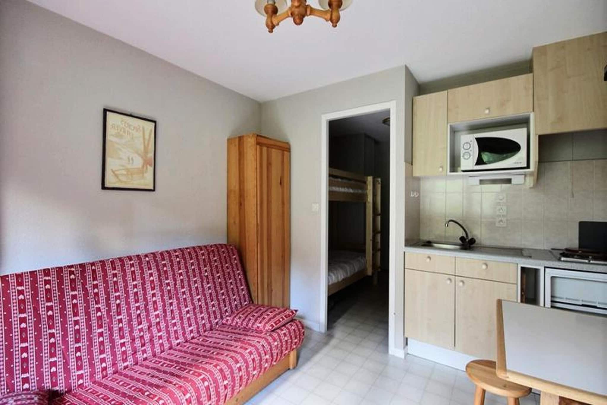 This functional and cozy studio apartment accommodates up to 4 people, featuring a sleeping area with a bunk bed and a sofa bed (160x200). It is located on the 2nd floor of a building with an elevator, offering convenient access to the ski resort. The studio is not pet-friendly, and guests will need to bring their own bed linens and towels, as they are not provided. Duvets and pillows are available for all beds, ensuring a comfortable stay.
Ideally situated in the heart of the Grande Terche ski resort, this apartment is just 20 meters from the ski lifts, making it perfect for winter sports enthusiasts. Bars, restaurants, ski rental shops, and the ESF (French Ski School) are all within walking distance, offering guests the convenience of having everything they need nearby. Whether you're looking for a place to eat or equipment to rent, you'll find it all at your doorstep, with access to the Portes du Soleil area just 10–15 minutes away by car.
The studio features a well-equipped kitchen with electric hobs, a refrigerator, and a mini oven, allowing guests to prepare meals during their stay. The living room area includes a dining table with chairs, a sofa bed, and a television. A separate toilet and a bathroom with a sink add to the practicality of the space. Additionally, the apartment offers a balcony with a westward-facing view of the ski slopes, perfect for unwinding after a day of adventure.
