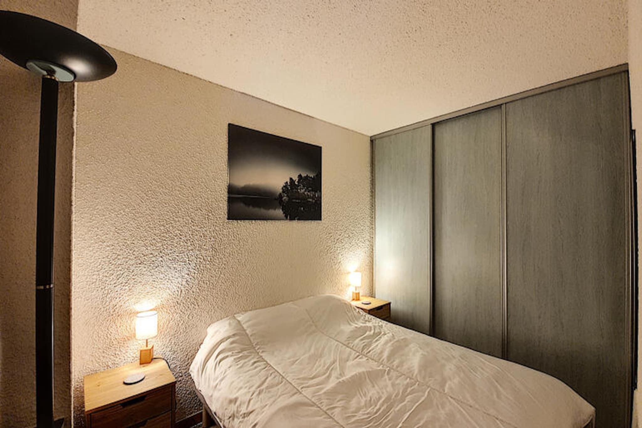 This cozy apartment for 4-5 people is located in the heart of the St Jean d'Aulps ski resort, just 150 meters from the ski lifts. The apartment features a separate bedroom with a double bed (140x190 cm), a sleeping nook with a bunk bed (90x190 cm), and a comfortable living area with a sofa. It is not pet-friendly and does not provide bed linen or towels, though duvets and pillows are provided. The apartment is on the 2nd floor of a secure building with collective parking and a ski locker for your convenience.
The apartment's prime location allows guests to easily access the ski lifts, making it perfect for skiing and outdoor activities. The resort offers a variety of dining options, cafes, and shops within walking distance, creating a lively and convenient atmosphere. Additionally, the larger Portes du Soleil ski area is just a short drive away, expanding your skiing options.
Inside, the apartment is fully equipped for a comfortable stay with a kitchen featuring 2 electric hotplates, a refrigerator, mini-oven, dishwasher, microwave, kettle, and coffee maker. The living area includes a TV and dining space, with a French window leading to the west-facing balcony with views of the chalet. The bathroom offers a bathtub with a towel dryer, and there is a separate toilet for added convenience.