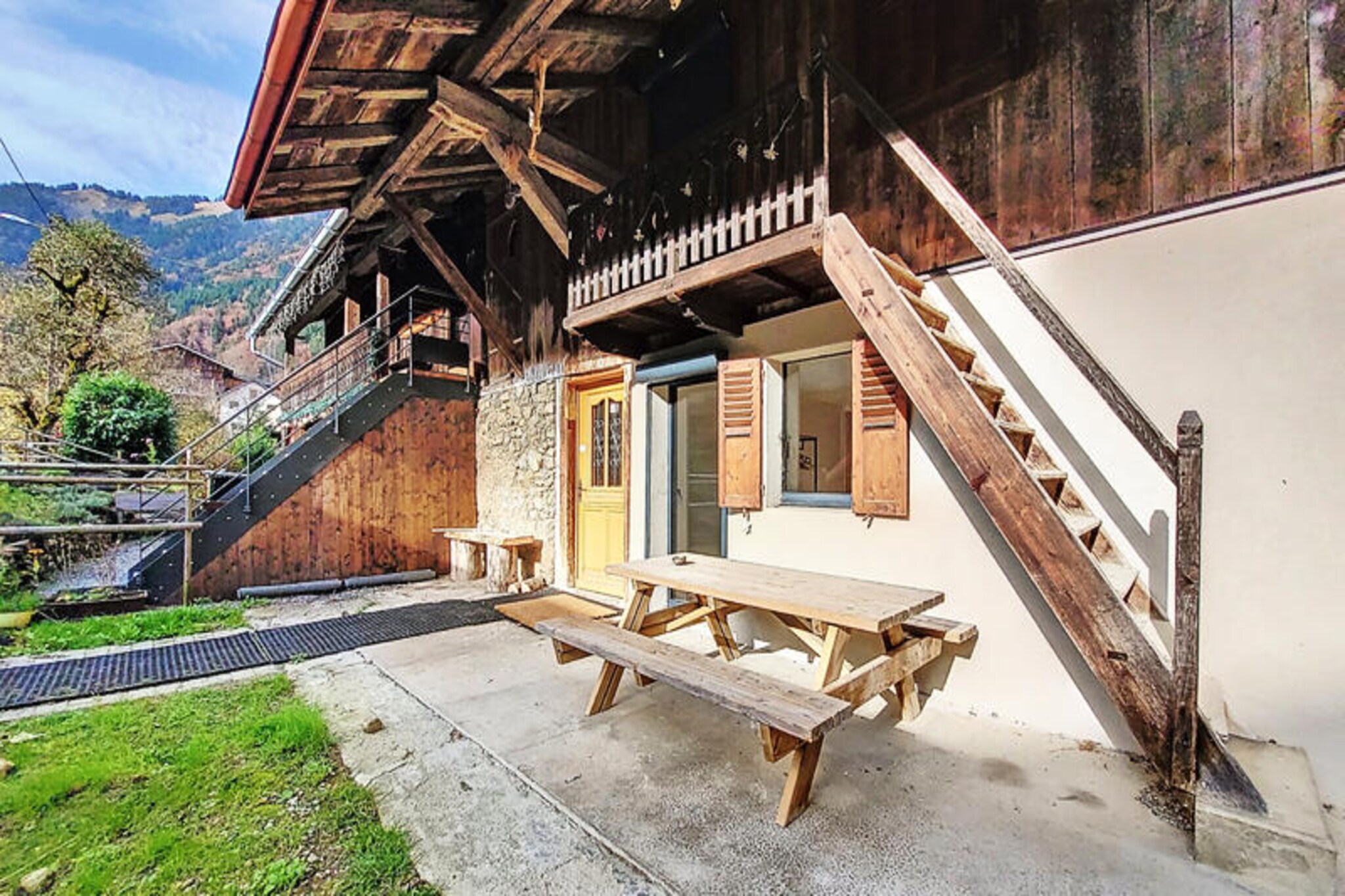 This spacious chalet is ideal for large groups, accommodating up to 12 people across two floors. The chalet features six comfortable bedrooms, including two master suites with en-suite showers, and a mezzanine with four single beds. It also includes a convertible sofa in the living room, ensuring ample sleeping space. Pets are allowed (except for category 1 and 2 dogs), making it a great choice for families with pets. Duvets and pillows are provided for all beds, but bed linen and towels are not, so guests should bring their own.

Located at the foot of the slopes in the Saint Jean d’Aulps station, this chalet is perfect for ski enthusiasts. The ski room with laundry facilities, shoe and glove dryer, and ample space for storing gear adds convenience to the experience. The chalet is also close to local cafes, shops, and restaurants, offering everything needed for a comfortable and enjoyable stay. The nearby area is great for winter sports, and visitors can also explore other attractions in the Saint Jean d'Aulps resort.

Both floors of the chalet feature fully equipped kitchens with modern amenities like induction hobs, dishwashers, ovens, and refrigerators. The living rooms are bright and spacious, each with comfortable seating and a TV. Additional amenities include a dining area, multiple shower rooms with towel dryers, and a separate toilet on each floor. Guests can enjoy the outdoor terrace with a barbecue for summer meals, as well as a bicycle storage room for those visiting during warmer months.