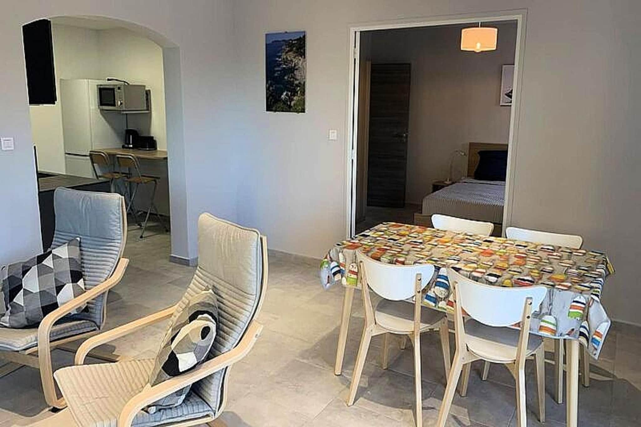 This spacious 80m² T4 apartment, perfect for up to 6 guests, is divided into two independent accommodations. The T3 apartment features a double bedroom (queen-size bed 160x200), a bedroom with two single beds (90x200), a large living room, and a bathroom. The adjoining studio includes a queen-size bedroom (160x200), a kitchenette, a bathroom, and a loggia with a dining table. Non-smoking and pet-free, this property ensures a peaceful environment for your stay. Bed linens and towels are available at an additional charge, and end-of-stay cleaning is included.

Located just 100 meters from the sea with direct access, this apartment offers easy access to the stunning beaches and attractions of Sanary-sur-Mer, Gaou Islands, Les Embiez, Porquerolles, Cassis, Bandol, and Le Castellet. Explore charming villages, picturesque coves, and enjoy local cafes, markets, and restaurants offering the finest Provencal flavors. 

The apartment boasts a well-equipped kitchen with a refrigerator, microwave, and hob for self-catering. The private outdoor space features a 40m² south-facing terrace with garden furniture, perfect for enjoying meals outdoors. The accommodation includes a bathroom in each unit, and heating is available for comfort throughout the year.