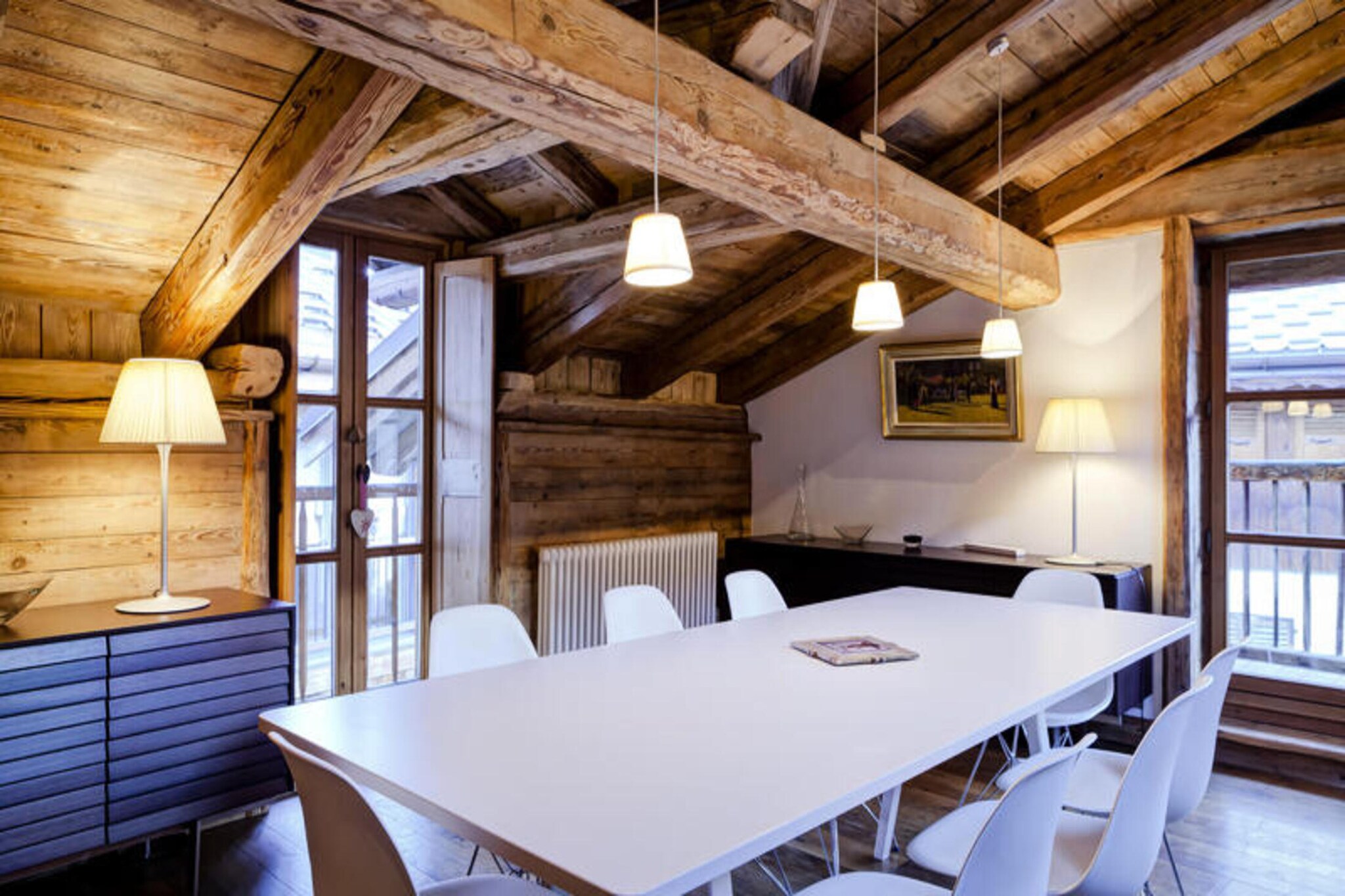 This charming 180 m² chalet is ideal for groups or families, accommodating up to 8 adults in comfort. It features four well-appointed bedrooms, each with an en-suite bathroom, including one master bedroom with a bath and double sinks. Two bedrooms offer a shower room for convenience, while the remaining room boasts a bath with a single sink. The chalet is non-smoking and does not permit pets, ensuring a serene environment for your stay.
Located in the heart of Courchevel Le Praz, this chalet is just 150 meters from the village center, offering easy access to local cafes, restaurants, and shops. The slopes are also within 500 meters, making it a perfect spot for ski enthusiasts. Explore the picturesque village, filled with local charm and amenities, or enjoy the tranquil atmosphere that Courchevel Le Praz provides.
The property includes a spacious living room with a TV lounge, a dining area for 8 guests, and a fully equipped open kitchen. A laundry room and a ski room with a shoe dryer add convenience to your stay. With modern amenities and a warm, cozy ambiance, this chalet is designed for both relaxation and adventure.