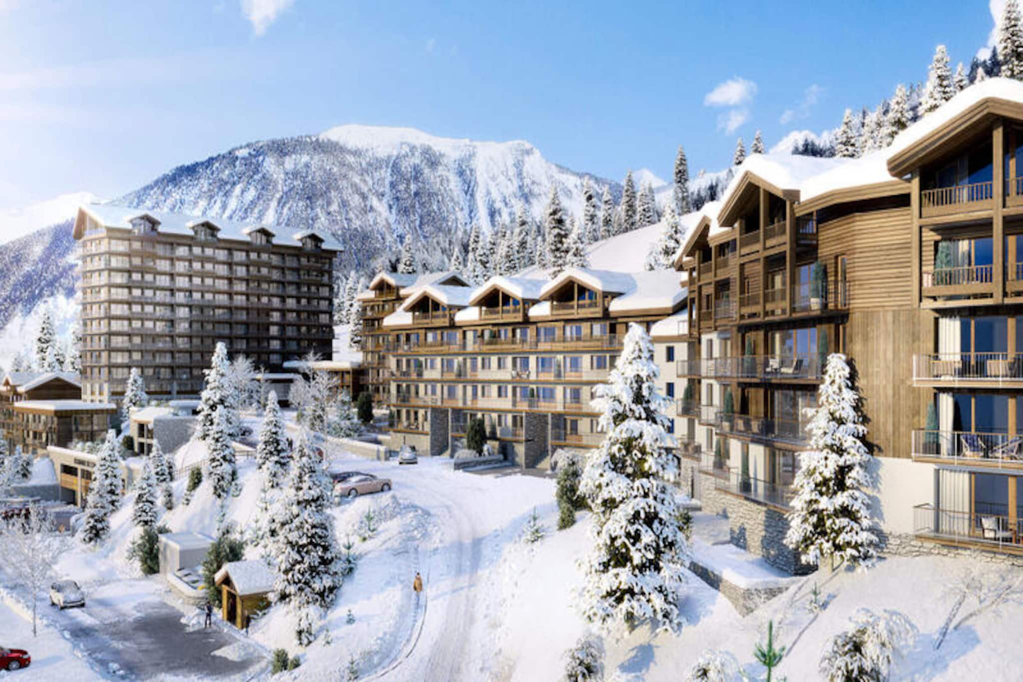 This newly renovated apartment in Courchevel Moriond offers 63 m² of luxury living space, ideal for 6 guests. The property features 3 bedrooms, including two double rooms with access to the balcony and a private bathroom in one, plus a cabin room with a bunk bed. The apartment is non-smoking and pet-free, ensuring a peaceful environment. Bed and bathroom linens are provided, along with end-of-stay cleaning, for a hassle-free experience.
Located just a short distance from the “Petit Moriond” gondola, the apartment offers ski-in/ski-out access, making it perfect for skiers. The free shuttle at the foot of the building provides easy access to all the resorts of Courchevel and the Aquamotion aquatic center, just 5 minutes away. Nearby shops, cafes, and markets enhance the convenience of this prime location, offering everything you need for a relaxing stay.
Inside, the apartment boasts a spacious living room with an ethanol fireplace and large windows leading to a 16 m² balcony with stunning mountain views. The high-end open kitchen is fully equipped, and the dining area comfortably seats 6. An independent bathroom with a spa bath and a separate WC adds to the comfort and convenience of the space.