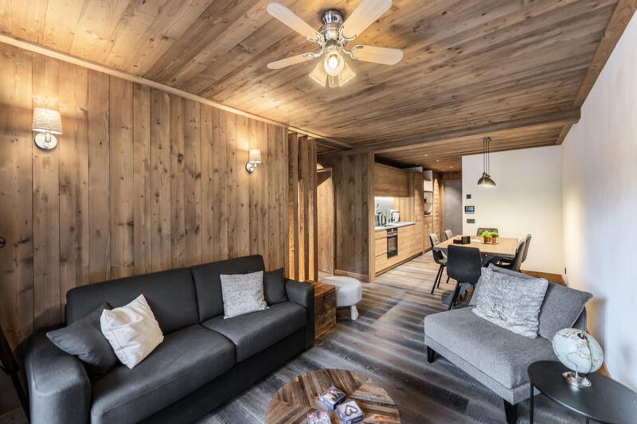 This modern apartment in the brand-new Marmottons residence offers a comfortable stay for up to four adults and one child. The spacious living room comes with a television and dining area, perfect for unwinding after a day on the slopes. The two bedrooms include a double (or twin) room with a TV and a triple room featuring a double (or twin) bed and a mezzanine bed, also with its own television. Fresh linens and towels are provided, with made-up beds on arrival. Please note that pets are not accepted, ensuring a tranquil stay for all guests.

Set in the heart of Courchevel Le Praz, this apartment is ideally located for exploring the charming village and its nearby attractions. Take a short walk to delightful cafes offering freshly brewed coffee and local treats, or browse the local markets to pick up some fresh produce and artisanal goods. During winter, the ski slopes are within easy reach, providing endless opportunities for skiing or snowboarding right from your doorstep.

The apartment comes fully equipped with a modern kitchen, ideal for preparing meals during your stay. A shower room and separate toilets add convenience and privacy. For added comfort, the property offers a ski locker for safe storage of your gear and an indoor parking space in the underground garage. Essential services such as Wi-Fi, housekeeping during the winter, and end-of-stay cleaning are included for a stress-free experience.