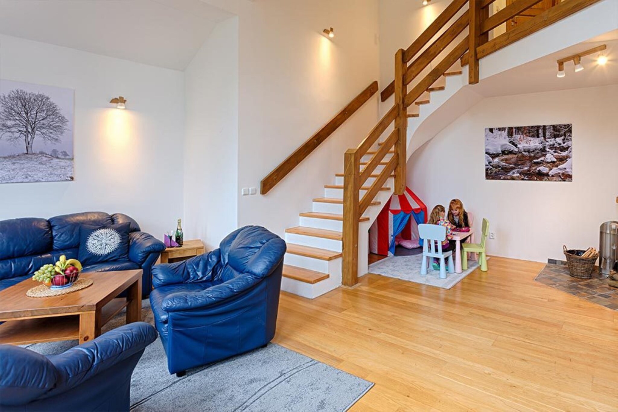 Harrachov, located in the Giant Mountains, is a vibrant destination offering year-round activities. This expansive villa, renovated to provide modern comfort, consists of three separate apartments, each with its own private space and amenities. With a total area of 330 square meters, the villa can accommodate up to 25 people (24 adults maximum), making it an ideal choice for larger groups or family gatherings. Guests can enjoy a variety of outdoor spaces, from the terrace overlooking the garden to the balconies offering stunning views of the surrounding landscape. Private parking is available, ensuring convenience for all guests.

The villa features a beautifully landscaped garden with a 20mÂ² furnished terrace, complete with a BBQ and fireplace for guests to enjoy outdoor dining. Children will love the play area, which includes a slide, sandpit, and sports equipment. Ski enthusiasts will appreciate the ski storage area, keeping gear safe during winter months. The villa offers a selection of apartments, including a spacious unit with a fully equipped kitchen, dining room, and barrier-free rooms, perfect for 12 people. 

In the winter, Harrachov boasts the third-largest ski area in the Czech Republic, with ski slopes, rentals, and shops nearby. The villa is just a 19-minute walk from the famous Harrachov ski hills and a short distance from the ÄŒertova Hora chairlift. During the summer months, visitors can explore the stunning natural beauty of the Giant Mountains through hiking and cycling, as well as visit charming towns and villages.