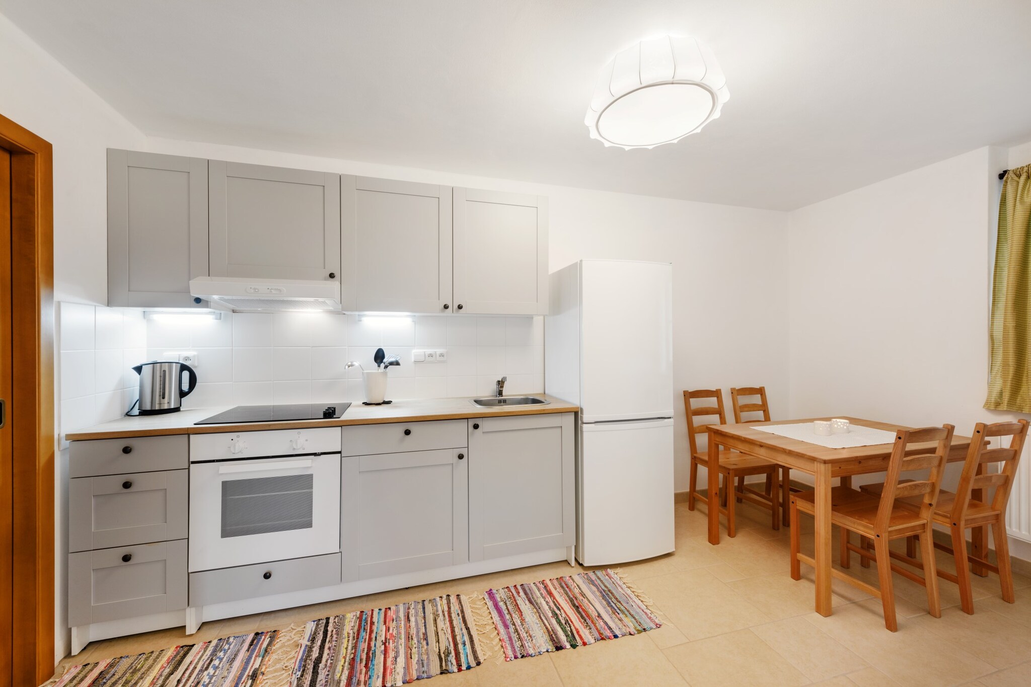 Ground floor: (Living room(double sofa bed, TV), Kitchen(hob, electric kettle, oven, microwave, dishwasher, fridge, freezer, dishes and cutlery), bedroom(single bed, single bed, single bed), bedroom(double bed), bathroom(bath tub, hairdryer))\n\nguest toilet, guest toilet, Internet access, washing machine, heating(central), terrace, garden(Barbecue center, garden furniture), iron, parking (paying)