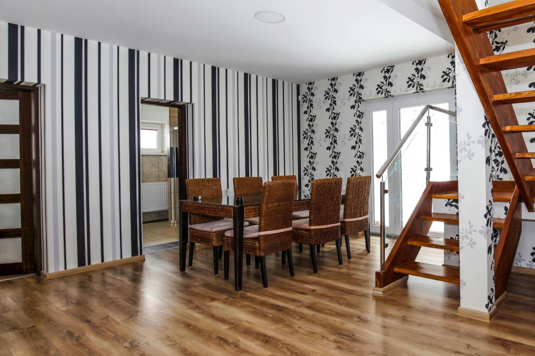 Ground floor: (Living room(TV, seating area), dining room(dining table), Kitchen(hob(electric), electric kettle, toaster, hood, oven, microwave, dishwasher, fridge, freezer, air conditioning, dishes and cutlery), bedroom(double bed), bedroom(single bed, double bed), bedroom(single bed, double bed), bedroom(double bed), bedroom(double bed), bedroom(double bed), bathroom(Mirror, bath tub, shower, washbasin), bathroom(Mirror, bath tub, shower, washbasin), toilet(washbasin, toilet), toilet(washbasin, toilet), Internet access)\n\nguest toilet(toilet, washbasin), guest toilet(toilet, washbasin), relaxation area(sauna, hot tub), Internet access, Internet access, washing machine, balcony, terrace, garden, garden furniture, BBQ, parking