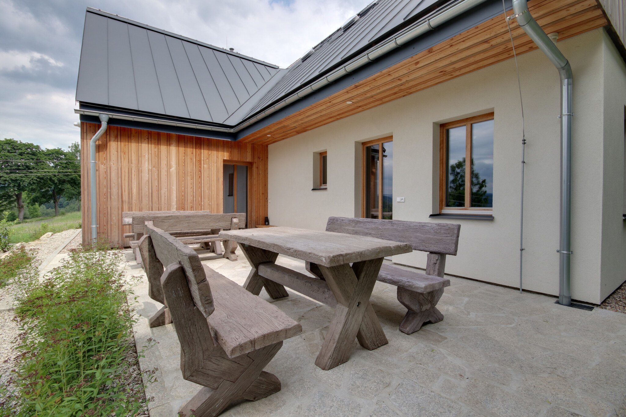 Ground floor: (Living room(TV, dining table, seating area, radio), Kitchen(hob(induction), electric kettle, toaster, coffee machine, oven, microwave, fridge, freezer, dishes and cutlery), bedroom(double bed), bedroom(double bed), bedroom(single bed, single bed), bedroom(single bed, single bed, double sofa bed), bedroom(single bed, single bed, single sofa bed), bathroom(shower, washbasin, toilet), bathroom(shower, washbasin, toilet), bathroom(shower, washbasin, toilet), toilet(toilet), Internet access)\n\nfireplace, terrace(35 m2), garden, garden furniture, BBQ, parking