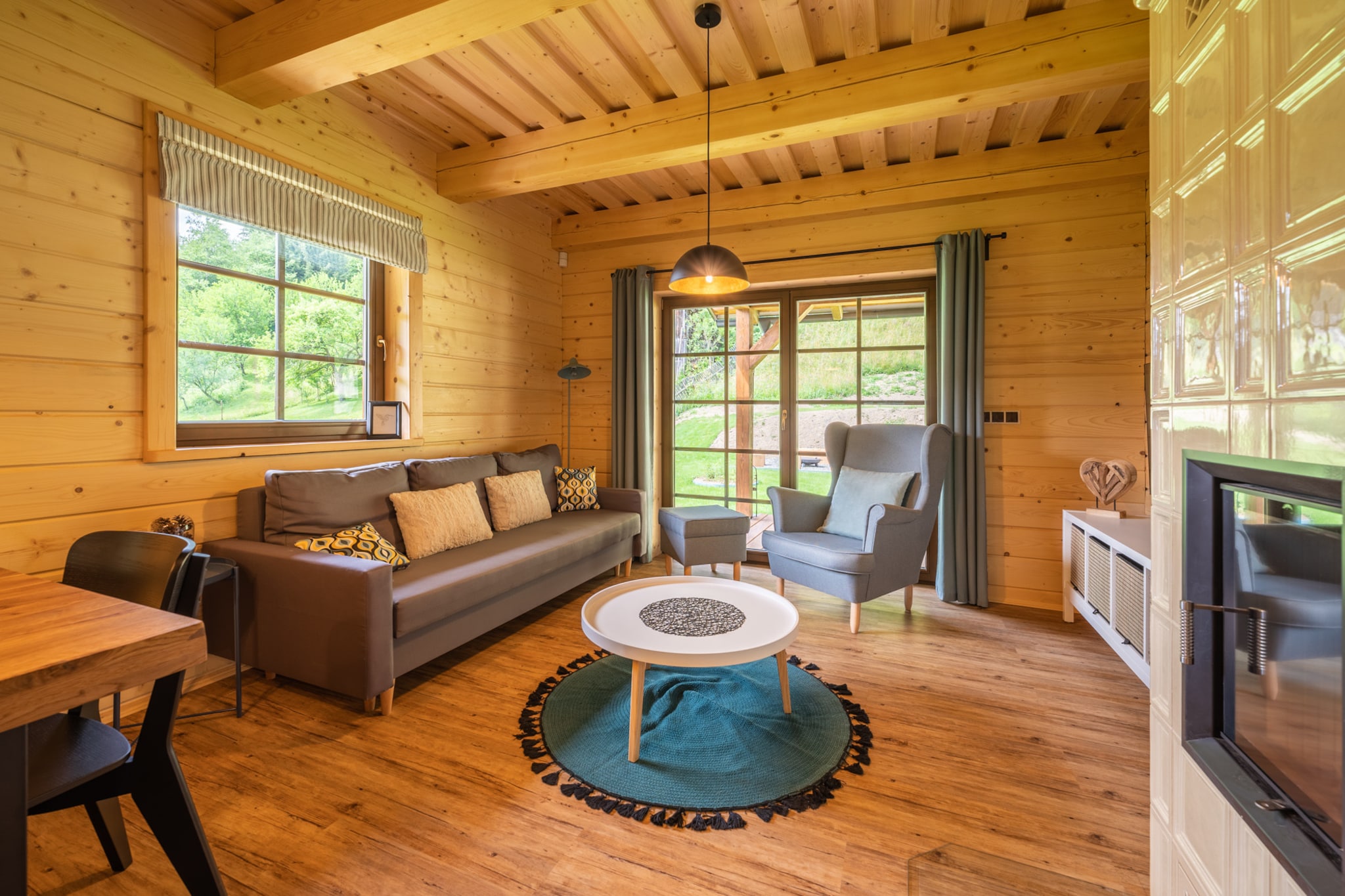 Escape to a magical retreat in the heart of the Beskydy mountains, where this stunning villa awaits your family or group of friends. Surrounded by towering peaks and lush forests, it offers breathtaking views, whether blanketed in summer greenery or winter’s enchanting snow. With accommodation for up to 16 people, this villa is a dream destination for those looking to create lasting memories.
Step outside and explore this picturesque region, year-round. In winter, ski slopes like Solan and Synot Kycerka are just a short distance away, offering thrilling runs for all levels. In summer, the nearby trails of Pustevny invite peaceful walks, or you can visit the adventure park in Roznov pod Radhostem.
Inside, you'll find a spacious haven perfect for gathering and relaxing. With 6 cozy bedrooms and 2 bathrooms, there's room for everyone to unwind. The fully equipped kitchen is a chef’s delight, complete with all the essentials—fridge, freezer, oven, microwave, and even a dishwasher, so meal prep and clean-up are effortless. Afterward, relax in the comfortable living room with a good book, a movie, or a fun game with loved ones. Kids will adore the playground in the garden, while adults can enjoy drinks and good conversation on the terrace.