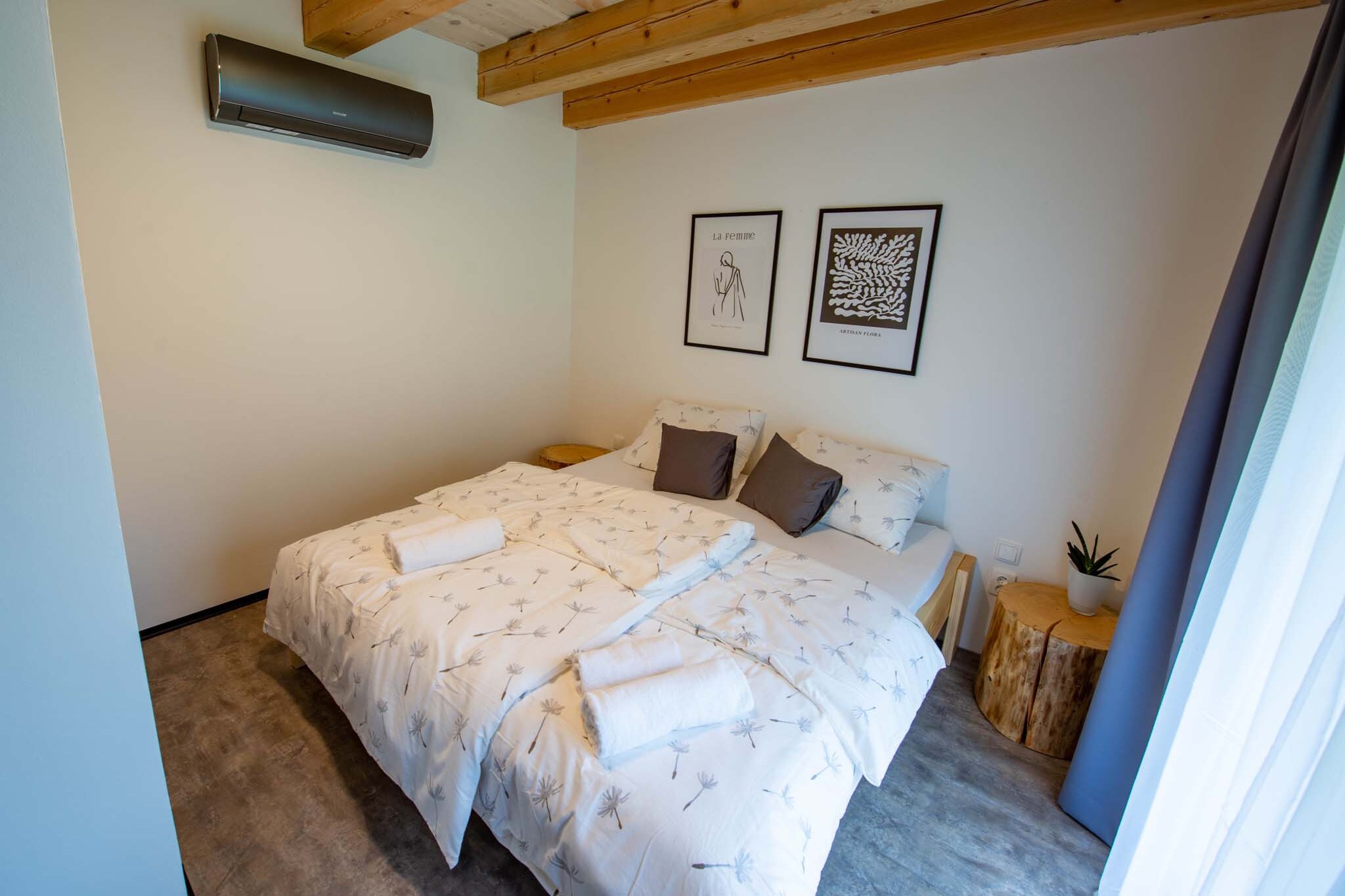 Nestled in the charming village of SmrÄek, in the heart of the VysoÄina region, this property offers a tranquil escape surrounded by nature. Known for its opal fields, SmrÄek is an ideal base for adventure seekers, offering easy access to outdoor activities and cultural experiences. Whether you're exploring the picturesque Czech countryside or relaxing in the comfort of your luxury accommodation, SmrÄek provides the perfect balance of peace and adventure.
SmrÄek is an excellent starting point for excursions to UNESCO heritage sites, such as the Pilgrim's Church in ŽÄár nad Sázavou and the historic city of TelÄ. Just 1.6 km away, you’ll find the stunning PernÅ¡tejn Castle, one of the best-preserved Gothic-Renaissance castles in Europe. For a change of pace, the lively city of Brno is only an hour’s drive away, offering everything from impressive architecture to family-friendly attractions. Explore the best of Czech culture, history, and nature from this perfect getaway.
Our property features two modern houses set amidst a serene orchard, each containing two stylish apartments. You can rent the apartments individually or book the entire property for group stays, weddings, or special events. Designed with large windows and light brown wood accents, the houses seamlessly blend with the natural landscape while providing all the comforts of home. Each apartment is equipped with modern amenities, including a fully furnished kitchen, air conditioning, and a private terrace where you can unwind after a day of exploration.