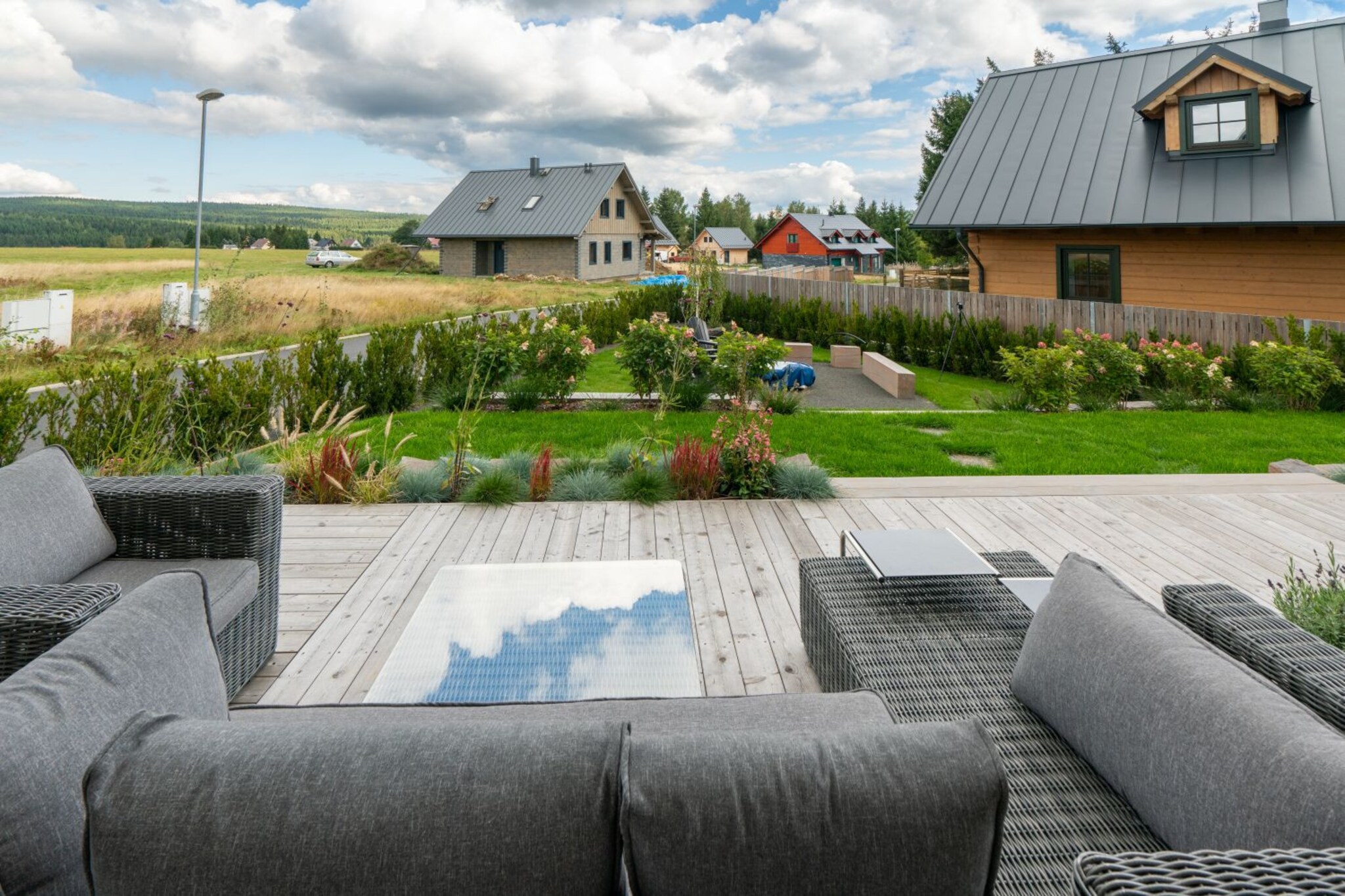 Living room(fireplace), Kitchen(stove, electric kettle, toaster, coffee machine, oven, microwave, dishwasher, fridge, freezer, high chair, Food processor), bedroom(double bed), bedroom(double bed), bedroom(double bed), bedroom(double bed), bathroom(bath tub, shower), bathroom(bath tub, shower), guest toilet, guest toilet, guest toilet, relaxation area(sauna), Internet access, grill, tumble dryer, washing machine, terrace(terrace), garden furniture, iron, parking (paying)