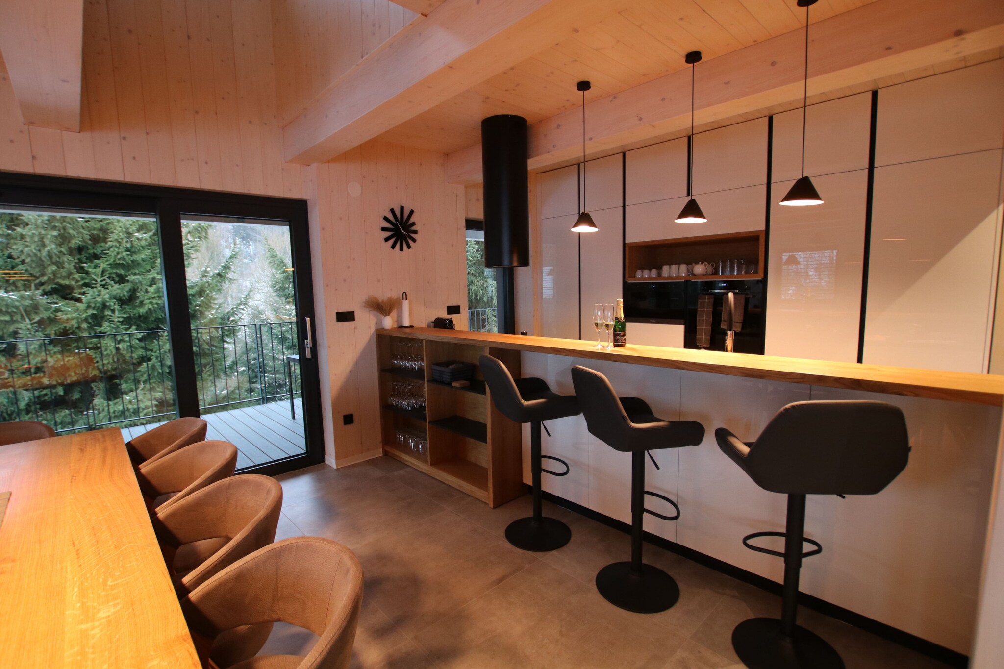 Ground floor: (open kitchen(hob(induction), electric kettle, toaster, coffee machine, oven, microwave, dishwasher, fridge, freezer, dishes and cutlery), Living/diningroom(TV, dining table, fireplace, seating area), bedroom(double bed, bunk bed), bedroom(double bed, bunk bed), bedroom(single bed, double bed), bedroom(single bed, single bed, single bed), bathroom(shower, washbasin, toilet), bathroom(shower, washbasin, toilet), bathroom(shower, washbasin, toilet), bathroom(shower, washbasin, toilet), bathroom(shower, washbasin, toilet), toilet(toilet), Internet access)\n\nrelaxation area(sauna), grill, heating(central), terrace(terrace(35 m2)), garden, garden furniture, parking, swimming pool(private, heated), parking (paying)