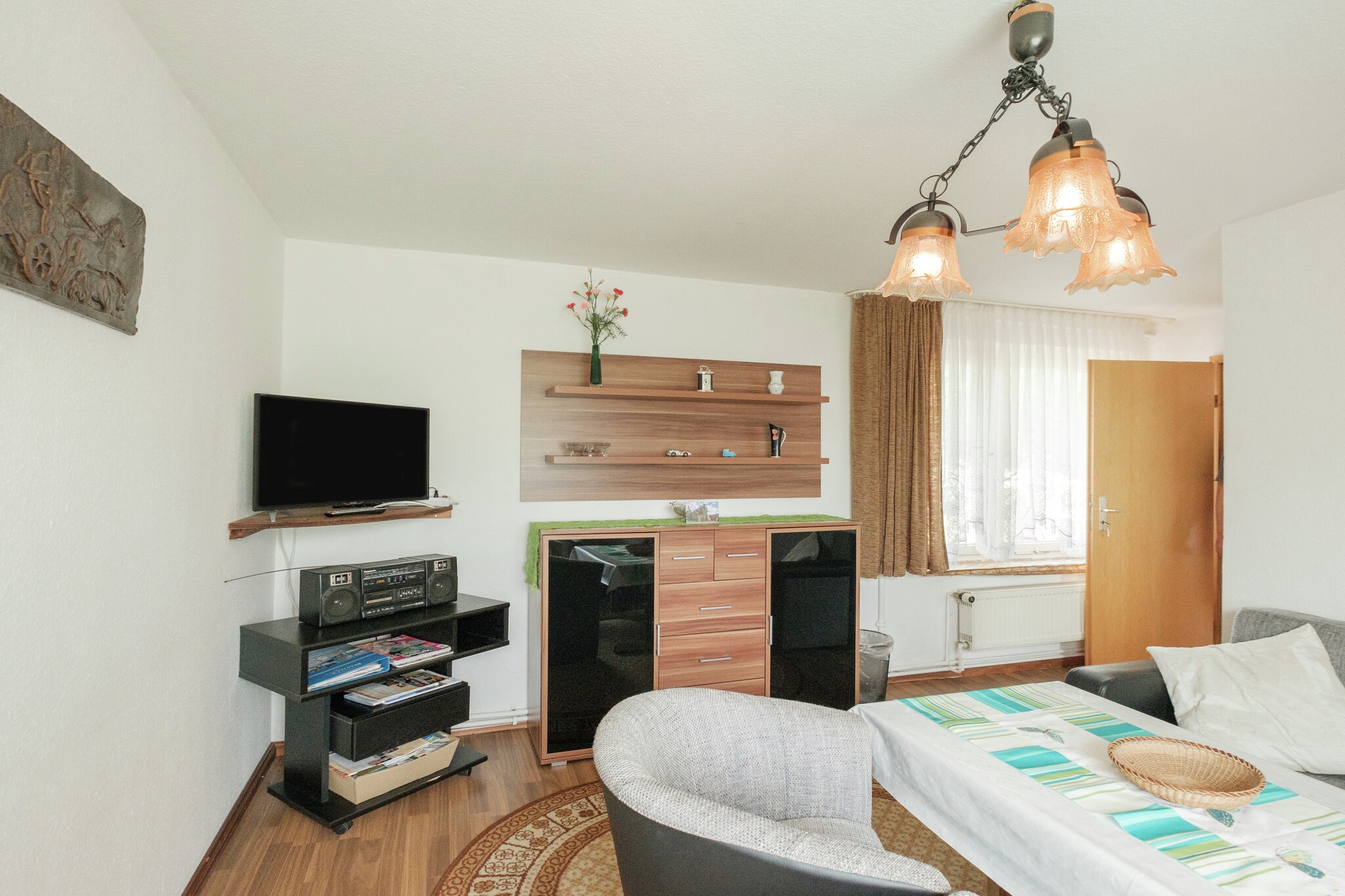 This welcoming ground-floor apartment in Ilsenburg offers a peaceful and pet-friendly retreat just 1 km from the town center. Perfect for families or small groups, itâ€™s ideally located to explore the Harz regionâ€™s highlights. Nearby attractions include the majestic Brocken summit, the romantic Ilse Valley, and the historic Wernigerode Castle. For cultural charm, Kloster Ilsenburg and the Aviation Museum provide fascinating insights into local heritage.

The apartment features a spacious living/dining room with satellite TV, stereo unit, and a cozy seating area. The fully equipped kitchen includes a coffee machine, oven, microwave, and fridge-freezer. Two bedroomsâ€”one with a single folding bed and double bed, the other with a double bedâ€”offer restful nights, while two bathrooms with showers ensure convenience. Central gas heating, a private terrace, shared garden, charcoal barbecue, and on-site parking round out the amenities.

Surrounded by forest trails and close to public transport, swimming pools, and ski slopes, the location is ideal for year-round adventure. Dining options nearby include the rustic Zur Waldschanke, fresh seafood at Mullers Fisch und Speisegaststatte, and Italian favorites at Pizza Italia.