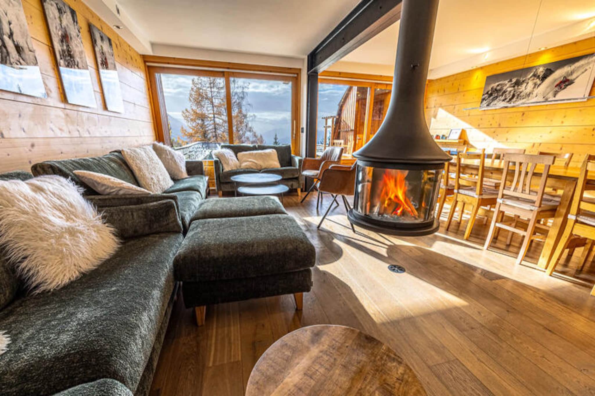 This spacious semi-detached chalet offers a serene mountain escape, accommodating up to 14 guests across three levels. With a mix of single, double, and pull-out beds, it’s ideal for families or groups. The cozy living room features a fireplace (wood not provided), while a private sauna provides a relaxing retreat after outdoor adventures. Bed linens are included, and beds are made upon arrival, except for short stays or in summer. Please note that pets are not allowed in the property.
Located in a peaceful area, the chalet offers ski-in, ski-out access with slopes just 50 meters away. The Arc 1600 resort center, bustling with shops and restaurants, is a 12-minute walk or shuttle ride away. Guests can admire breathtaking views of the slopes from the south-facing terrace and enjoy the area’s vibrant mix of dining, shopping, and outdoor activities, including skiing, hiking, and more.
This well-appointed chalet includes a fully equipped kitchen with induction hobs, an oven, a microwave, a refrigerator, and a dishwasher, perfect for preparing meals. Additional amenities include multiple bathrooms, a washing machine, a dryer, a ski locker, and an outdoor parking space. Enhanced security is provided through video surveillance and digital access controls, ensuring a safe and comfortable stay.