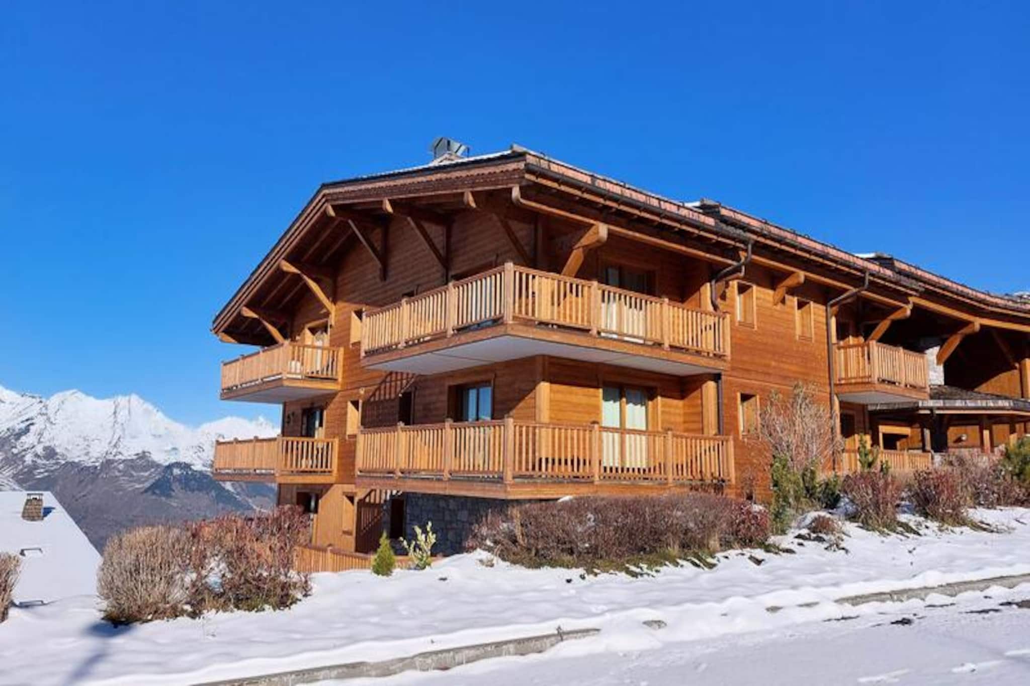 This spacious 4-room apartment offers a comfortable retreat for up to 6 guests, featuring a master suite with a 160 cm bed, a second bedroom with a double bed, and a third bedroom with two single beds. The apartment also includes a shower room, a bathroom with a bathtub, and two separate toilets. It is a non-smoking property and does not allow pets. The apartment provides bed and bathroom linen, and guests can enjoy free access to a swimming pool with a badge.

Located in the village of Chantel, the apartment is a short distance from various resort amenities. The free pedestrian "Dahu" cable car is just 100 meters away, while a shuttle bus terminal is only 50 meters from the residence, offering regular services in both winter and summer. The nearest mini-market is also just 100 meters away, and the ESF ski school is located at the snow front of the resort. Guests can easily access the village of Charvet for the Tourist Office and medical services.

The apartment boasts an open-plan kitchen with modern appliances, including an induction hob, oven, microwave, dishwasher, refrigerator, coffee maker, kettle, and toaster. The living room is spacious and comfortable, and there is also a ski locker and a parking space available. For entertainment, the apartment includes a television and free Wi-Fi access, ensuring a relaxing stay.