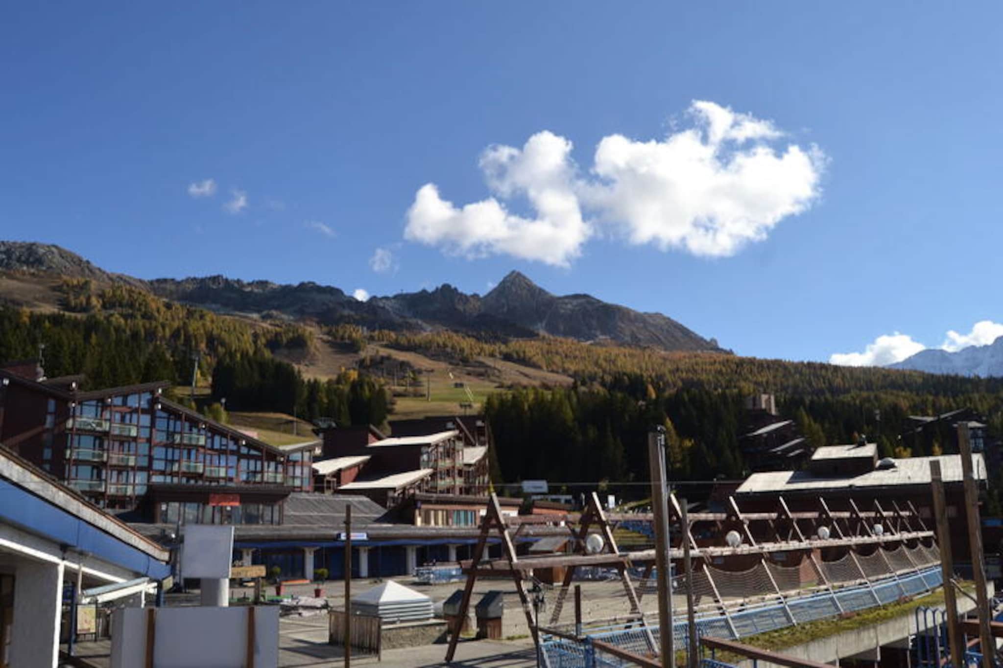 This inviting two-room apartment offers a comfortable retreat for up to six guests, featuring two single beds in the living area, two single beds in the bedroom, and a mountain corner with bunk beds (not suitable for children under six). A spacious balcony with a South-West orientation provides stunning views of the mountains and valley, perfect for unwinding after a day of activities. This pet-friendly property also includes Wi-Fi, a television, and a small washing machine, ensuring convenience and comfort throughout your stay.
Nestled in a prime location, the apartment is just 150 meters from the “Vagère” chairlift and 200 meters from the “Transarc” gondola, offering easy access to skiing and hiking trails. Nearby amenities include a supermarket, bars, restaurants, and the ESF ski school, all within a short walk. The shuttle stop, located 20 meters away, ensures effortless transportation around the resort. A five-minute stroll takes you to the Tourist Office and medical center, making it an ideal choice for exploring the vibrant village.
The apartment features a fully equipped kitchen with electric hobs, a microwave, refrigerator, dishwasher, and oven, ideal for preparing meals. The bathroom includes a bathtub and a separate toilet. Additional amenities such as parking options, linen rental, and pet accommodations enhance your stay. Non-smoking and designed with practicality in mind, this cozy mountain retreat is perfect for your next getaway.