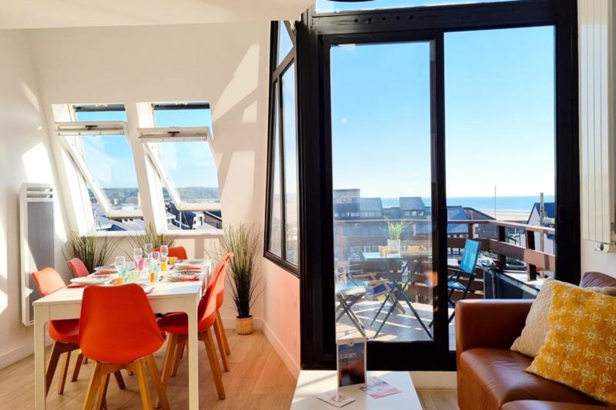 This elegant triplex in the heart of Deauville's marinas offers breathtaking views of land and sea. The apartment spans three levels, accommodating up to six guests with three queen-sized bedrooms, including one with a stunning sea view. Two modern bathrooms and a spacious living area with a Smart TV ensure comfort for all. The balcony/terrace provides an idyllic spot to unwind, while the fully equipped open kitchen makes meal preparation a pleasure. Bed and bath linens, free WiFi, a washing machine, and a dishwasher are included for your convenience.

Perfectly located, the property is just a five-minute walk from Deauville’s city center and casino. Explore the picturesque fishing port, nearby beaches, and vibrant cafes that define the area’s charm. The Deauville-Trouville SNCF station is a short 10-minute walk, offering easy access to local attractions. This secure, luxury residence ensures peace and quiet, while still placing you in the heart of the action.

Additional amenities include ironing facilities, private outdoor parking upon request, and a tranquil atmosphere perfect for relaxing. Breakfast is not included, but the proximity to local markets and bakeries makes dining options plentiful. Guests are kindly asked to respect quiet hours between 10 p.m. and 7 a.m. to maintain the serene environment. Your host will be available throughout your stay, ensuring a seamless and enjoyable experience.