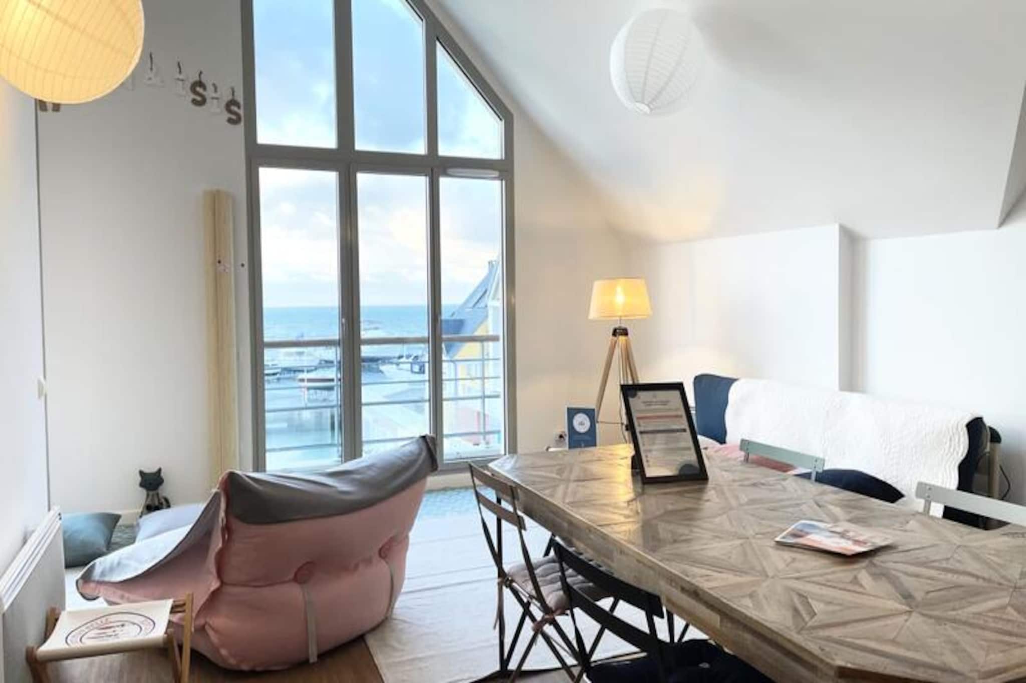 This elegant apartment, nestled in a secure luxury residence in the heart of the marinas, offers a serene retreat with breathtaking 180° sea views. Designed to accommodate up to two guests, it features a spacious bedroom with a plush queen-size bed (160x200cm) and a cozy living area with direct terrace access. Please note, the property does not have shutters, but temporary screens have been added to limit daylight exposure. Bed and bath linens are provided, but pets are not allowed, ensuring a peaceful stay.

Perfectly located just a 5-minute walk from the vibrant city center and casino, this apartment is ideal for exploring the charm of Deauville. Enjoy leisurely strolls along the marina or visit nearby cafes, boutiques, and markets. The Deauville-Trouville SNCF station is just 15 minutes away on foot, providing excellent connectivity for further adventures around Normandy.

The apartment boasts a modern open-plan kitchen, equipped with a dishwasher, washing machine, and essential appliances, ensuring convenience for guests. A stylish bathroom with a bathtub adds to the comfort, and free WiFi is available throughout the property. Guests can request a private parking space for added ease. This peaceful haven invites you to relax while remaining close to the vibrant heart of Deauville.