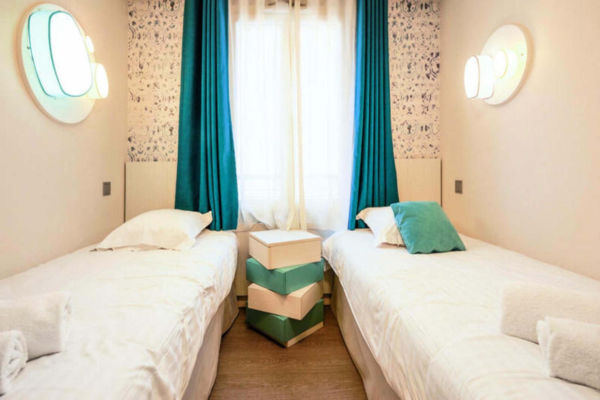 Located just 300 meters from the train station, this spacious 61 m² apartment offers two comfortable bedrooms, one with a double bed and the other with two single beds, perfect for up to four guests. The apartment includes two bathrooms, one with a shower and the other with a bathtub, as well as a separate toilet. Pets are allowed for an additional fee, and the residence offers a covered parking space for one car. With a balcony facing west, guests can enjoy a relaxing view of the residence’s gardens.

The property is ideally located between Deauville and Trouville, offering easy access to the beach (between 100 and 500 meters away) and a variety of outdoor activities, including golf, horse riding, and tennis. The famous Deauville resort is just a short walk away, while the nearby Spa Deep Nature wellness center is only 2 km from the apartment. The area also boasts numerous cafes, restaurants, and markets, making it an ideal base for exploring the local culture.

Inside, the apartment features a fully equipped kitchen, including an oven, microwave, fridge/freezer, and dishwasher, providing everything needed for a comfortable stay. The living area is bright and airy, with a sofa, dining table, and TV. With amenities such as air conditioning and an outdoor swimming pool, this apartment is a perfect retreat for a relaxing getaway.