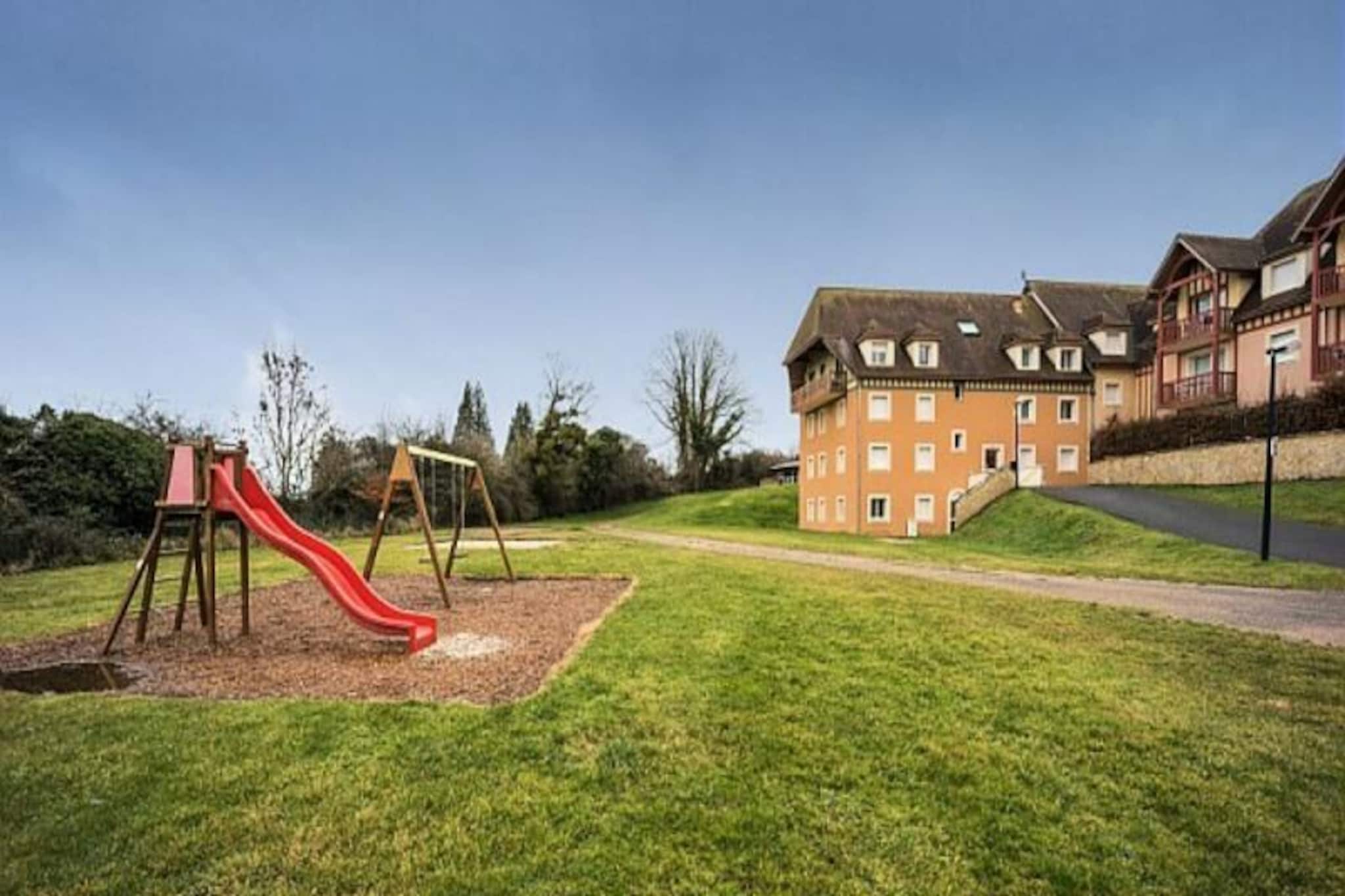 
This bright, ground-floor apartment offers a comfortable retreat for up to six guests with its two bedrooms and well-appointed living area. The first bedroom features a double bed, while the second includes two single beds. The living room offers additional sleeping arrangements with a trundle bed and sofa bed. Guests can enjoy outdoor relaxation in the private garden with southern exposure, and the property includes a dedicated parking space. The apartment provides a family-friendly environment, complete with access to a heated indoor pool and paddling pool during the summer months.

Located 3 km from the beach, this apartment is perfectly situated for enjoying the best of Saint Arnoult and its surroundings. Explore the nearby equestrian center and golf course, just 1 km away, or take a leisurely 2.5 km trip to the iconic “Planches” of Deauville. The town of Deauville itself, only a few kilometers away, offers sandy beaches, luxury boutiques, a casino, and cultural attractions like the Deauville-La Touques Hippodrome, known for its summer horse races.

The apartment includes a closed kitchen equipped with essential appliances, allowing you to prepare meals during your stay. The bathroom features a bathtub with a column shower, complemented by a separate toilet for added convenience. Additional services, such as WiFi, linens, and end-of-stay cleaning, are available for a seamless experience. This bright and well-maintained property is the perfect base for a relaxing coastal getaway.