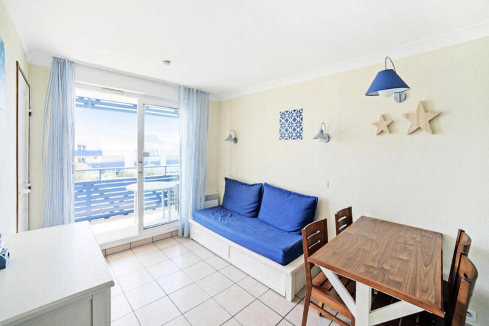 This apartment complex is located 300 meters from Lacanau-Océan's beach and lively center, ideal for family or friend vacations. The property features a shared swimming pool (open mid-June to mid-September).
While specific details about nearby cafes, restaurants, or shops aren't available, the description mentions the lively town center within walking distance, suggesting easy access to various amenities. Guests should be aware that construction work is currently underway on the residence.
Apartments are individually owned and vary in details, but all are generally well-equipped for a comfortable stay (although photos are not guaranteed to reflect your specific unit). This two-room apartment offers basic amenities like a living room, kitchen, bedroom, and bathroom. A “maeva Home Confort” label signifies good value for money with essential amenities. Keep in mind that many services are offered for an additional charge, including Wi-Fi, linens, towels, baby kit rental, end-of-stay cleaning, and covered parking. Outdoor parking is free. Pets may be allowed in certain apartments; inquire directly with the residence for fees.